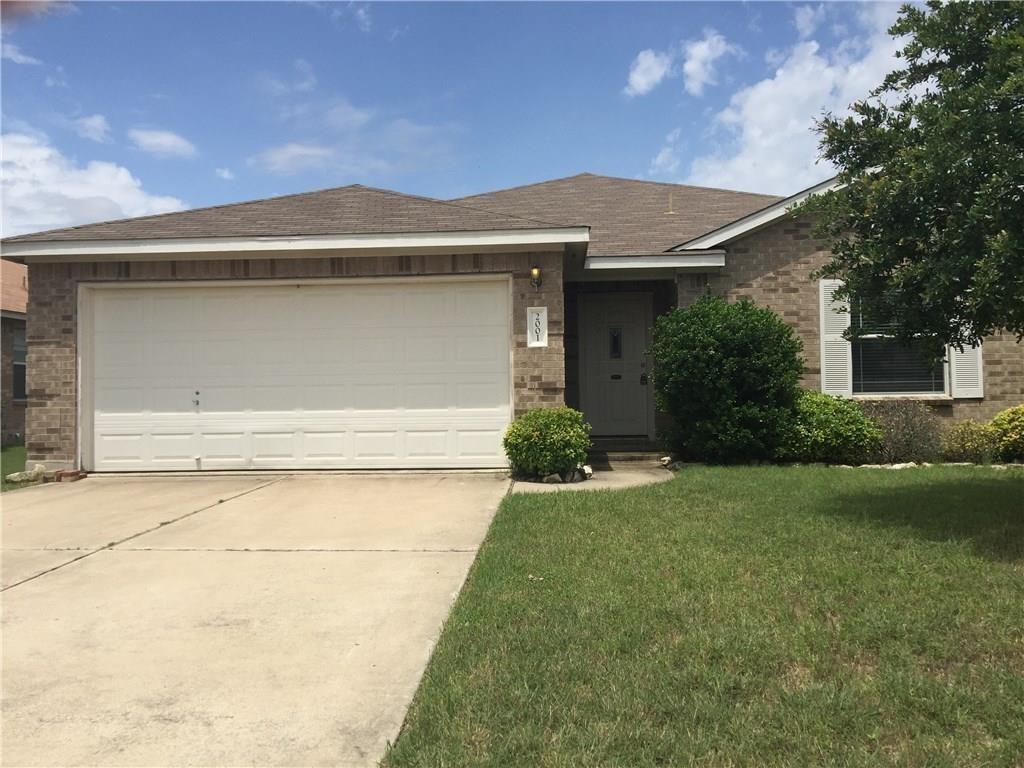 Classic brick exterior and a neat concrete drivew
