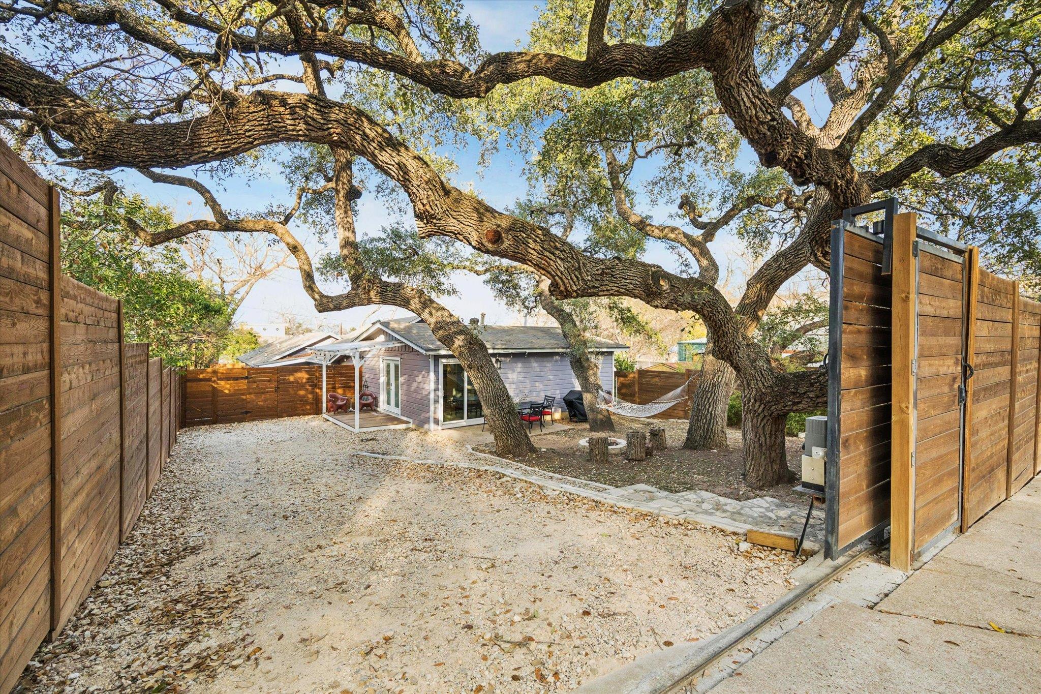 Fenced backyard with a patio