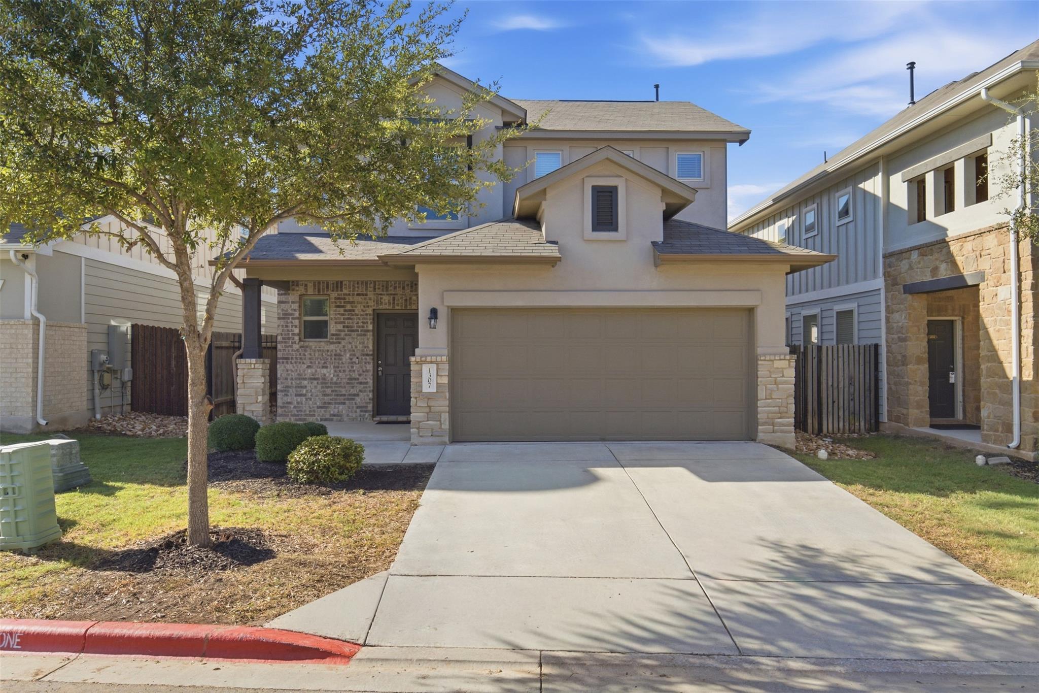 A classic concrete driveway leads to an integrate