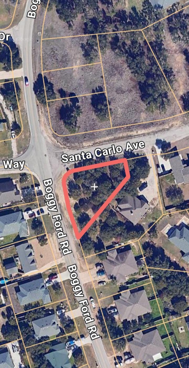 A corner lot nestled within an established neighb
