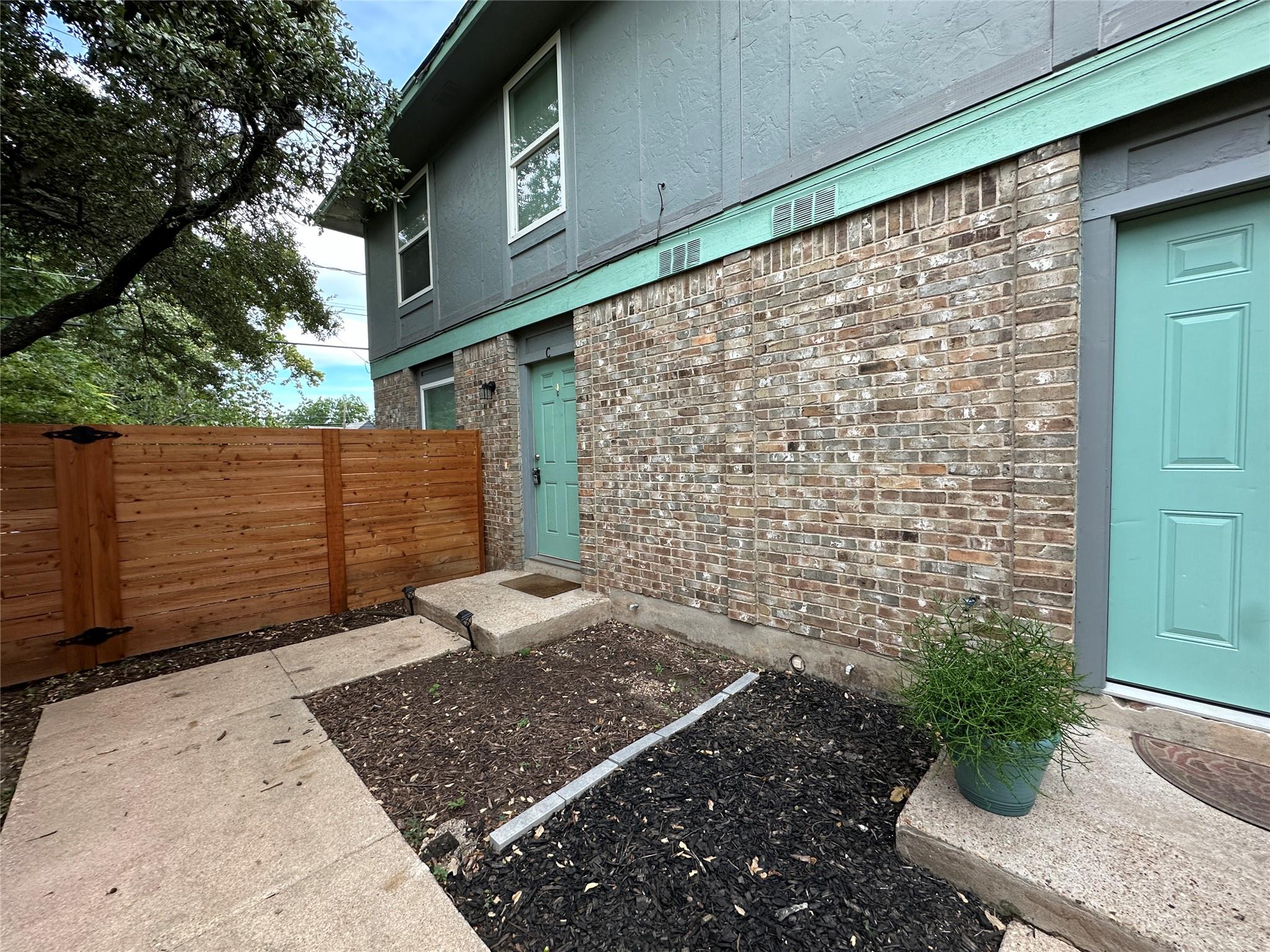 A welcoming entryway combines classic brick const