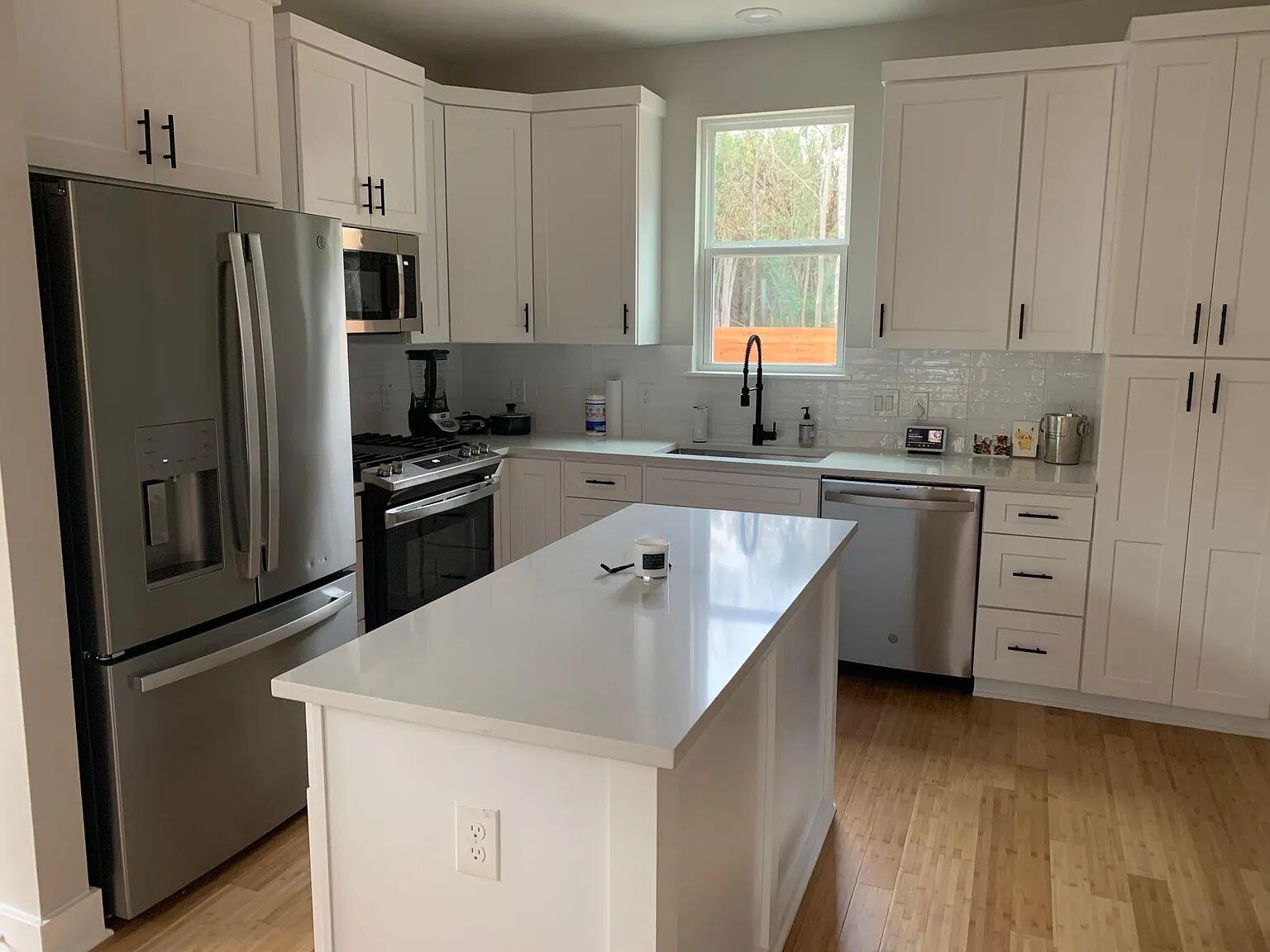 Polished stone countertops pair with clean cabine