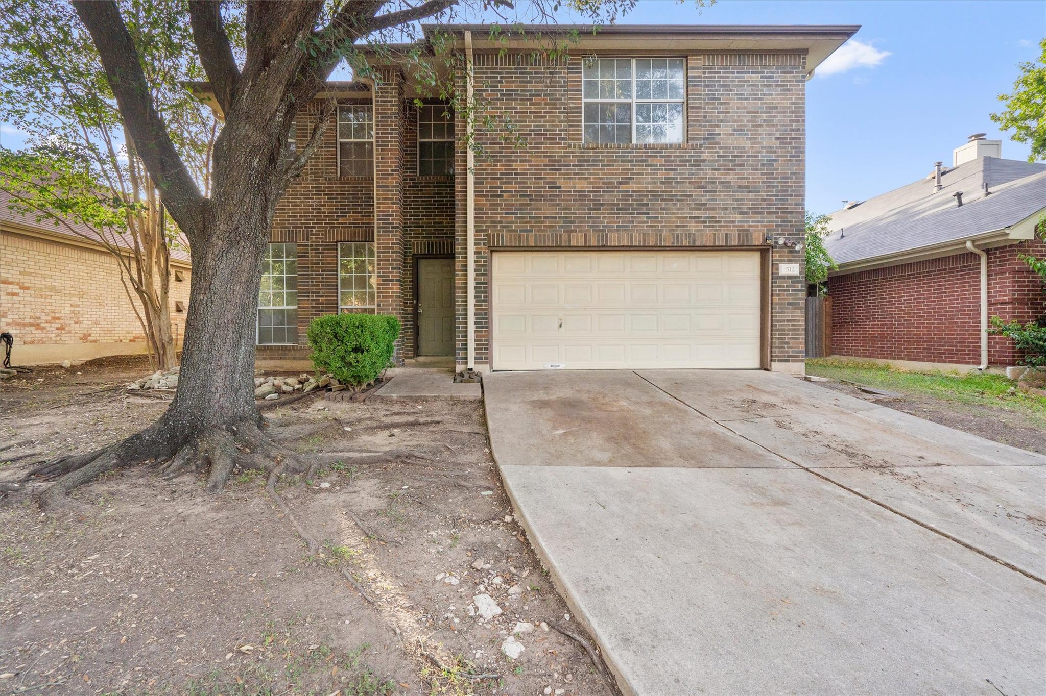 Classic brick exterior features a two-car garage 