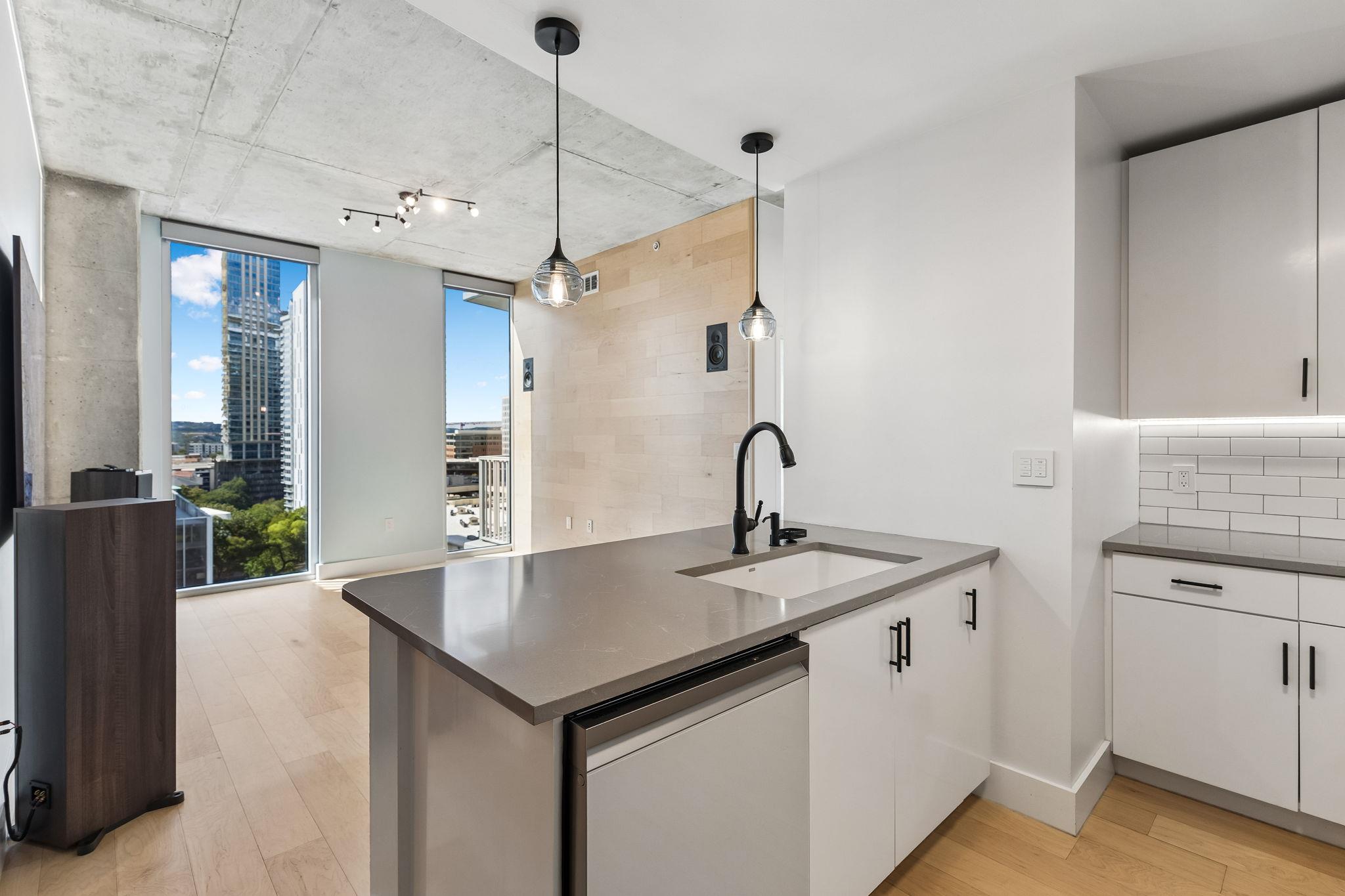 Industrial concrete ceilings and sleek stone coun