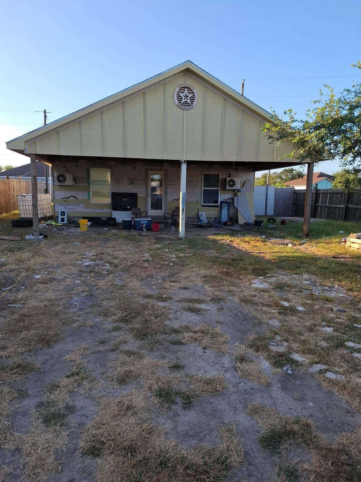 A spacious covered back porch overlooks the yard 