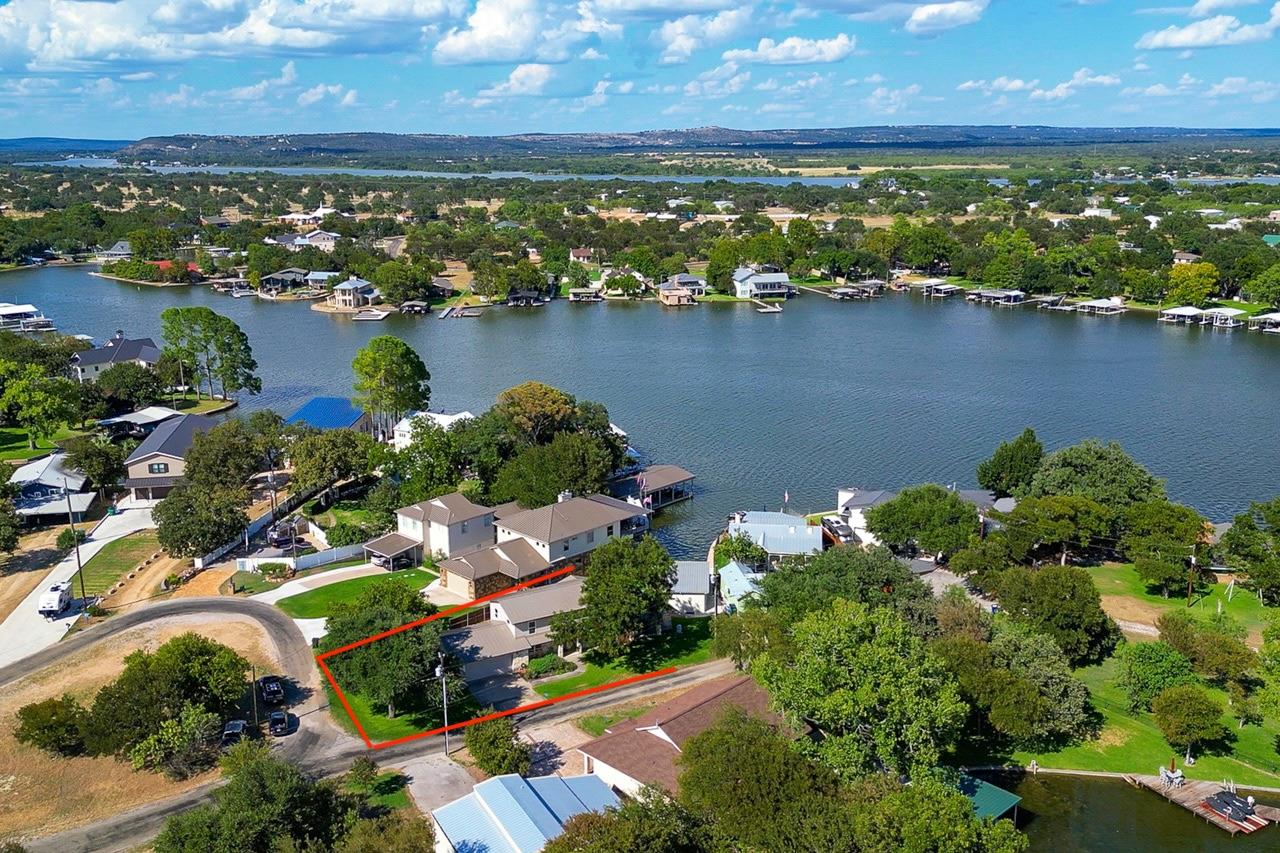 Aerial perspective reveals the home nestled withi