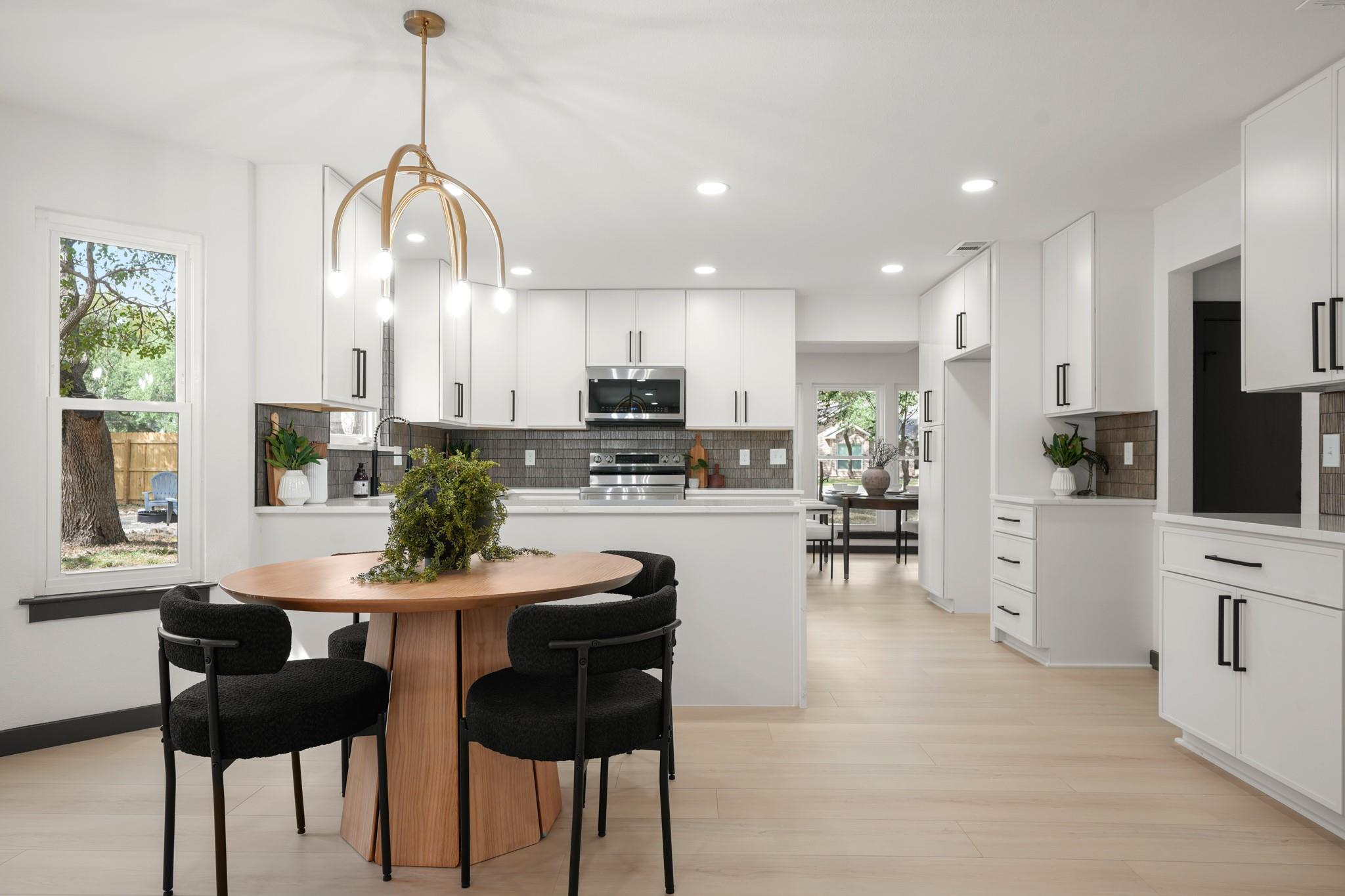 An open floor plan connects the sunlit dining are