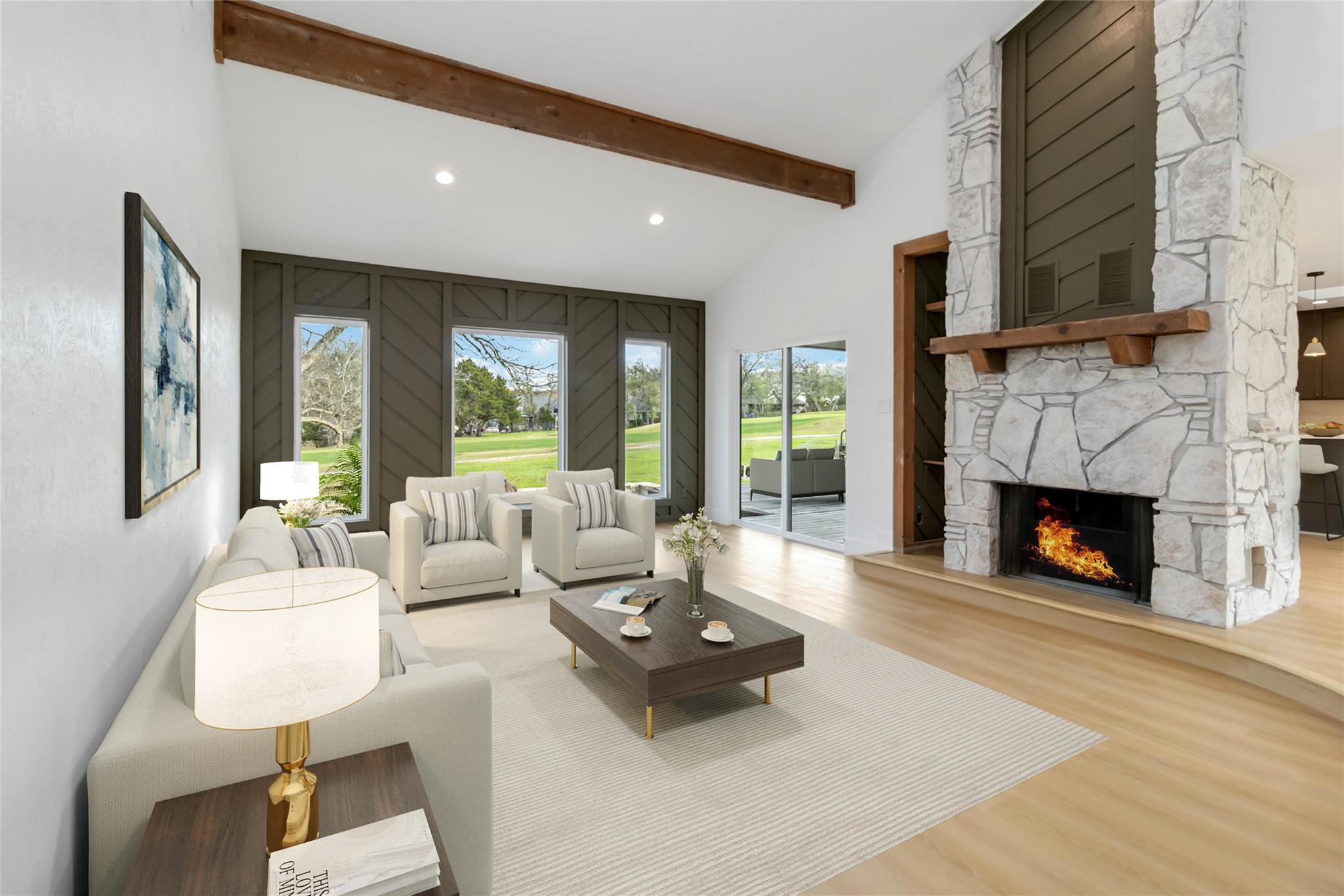 A floor-to-ceiling stone fireplace serves as the 