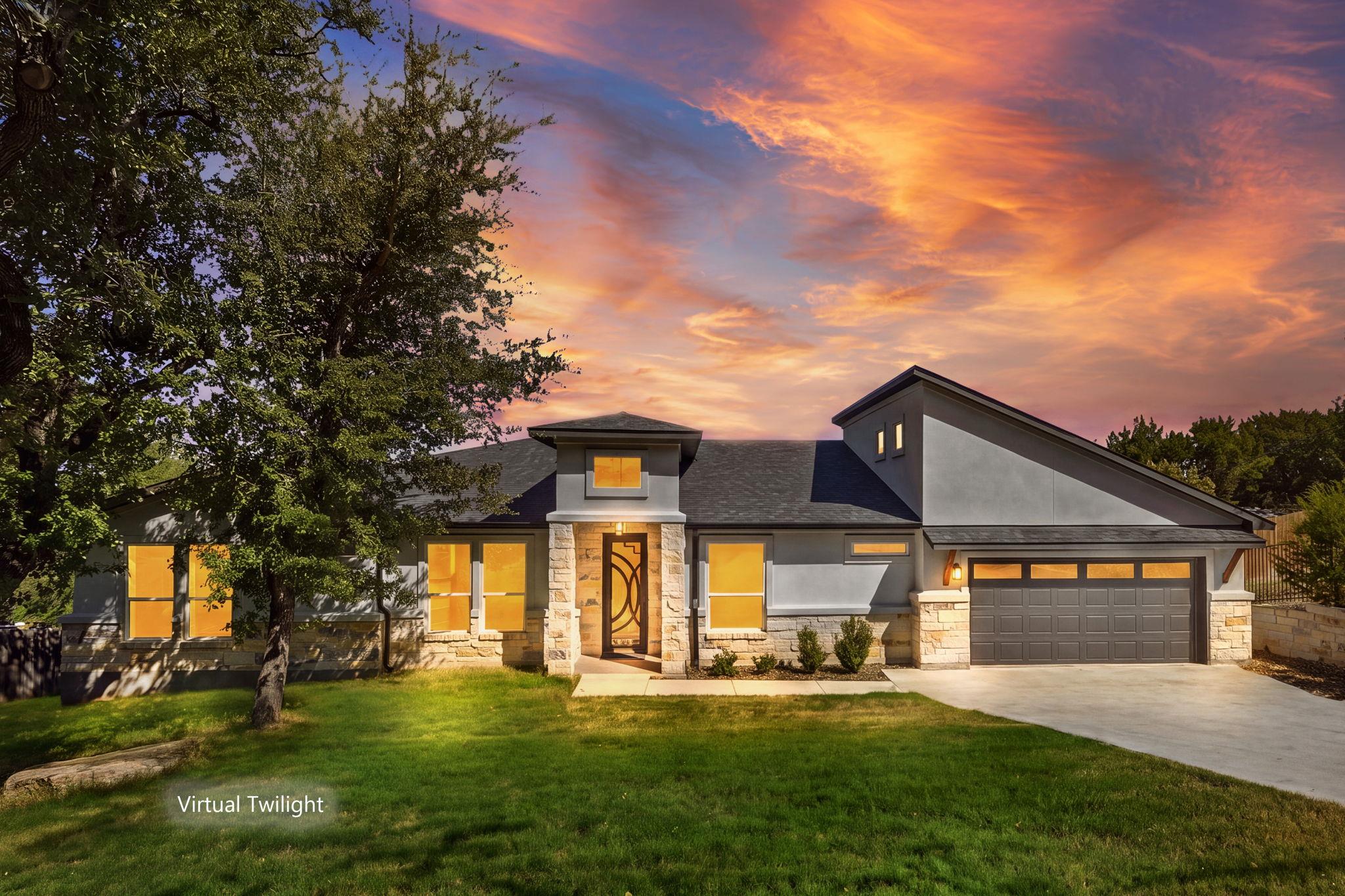 Dramatic rooflines and stone accents define this 