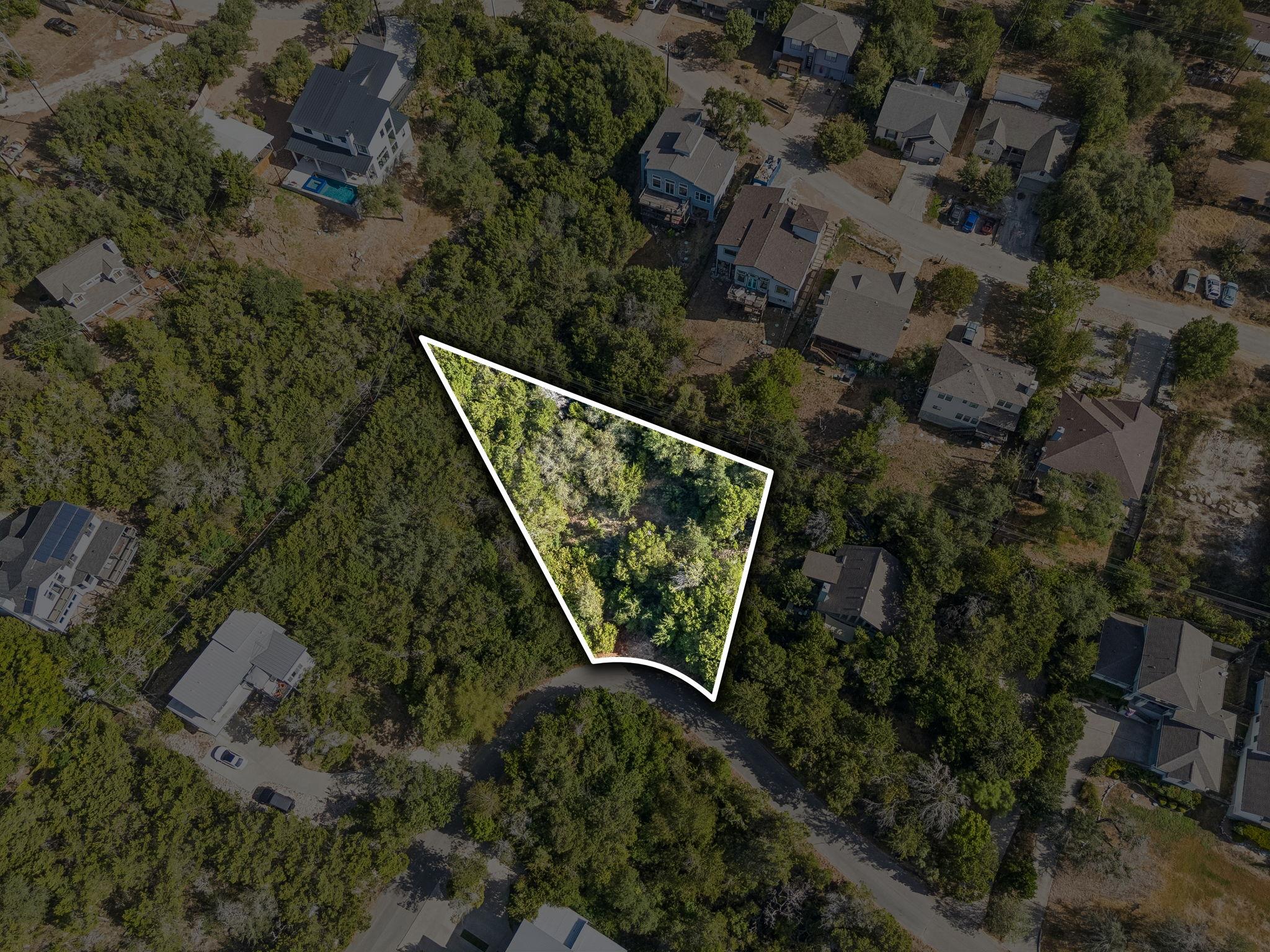Mature trees surround this private home site nest