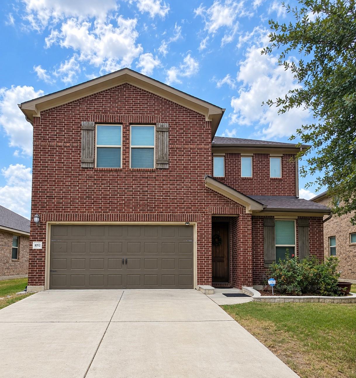 Classic brick exterior highlights this two-story 
