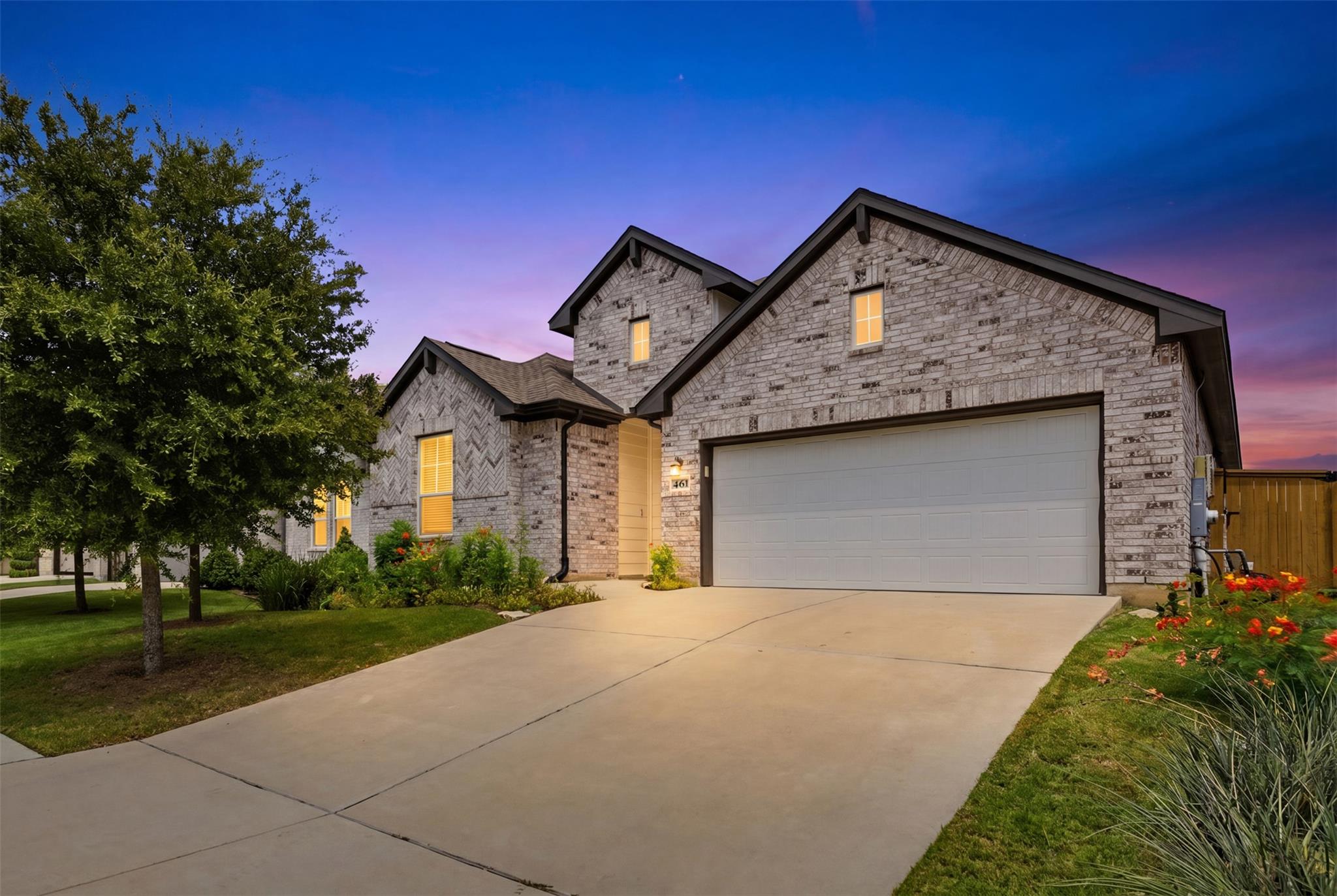 An inviting stone-accented facade stands tall aga