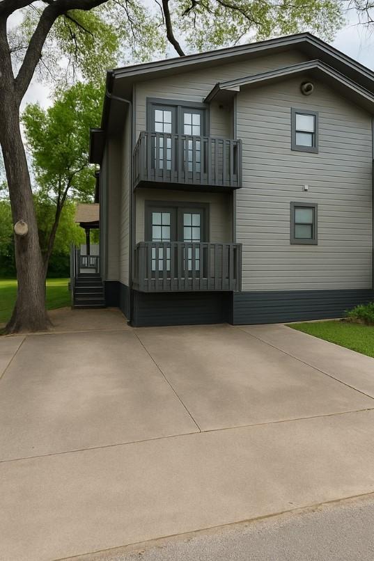 Dual exterior balconies accent the siding on this