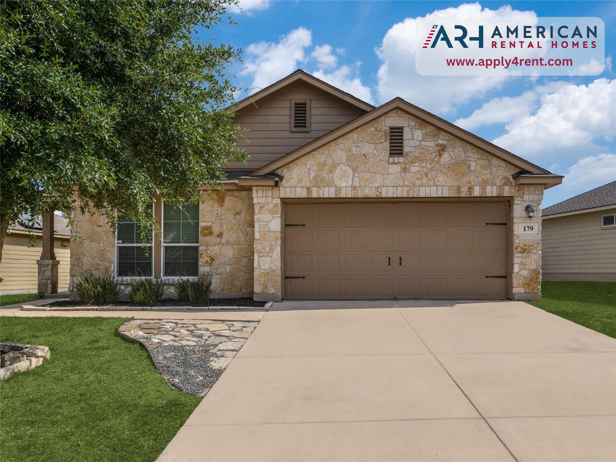 View of front of property with concrete driveway,