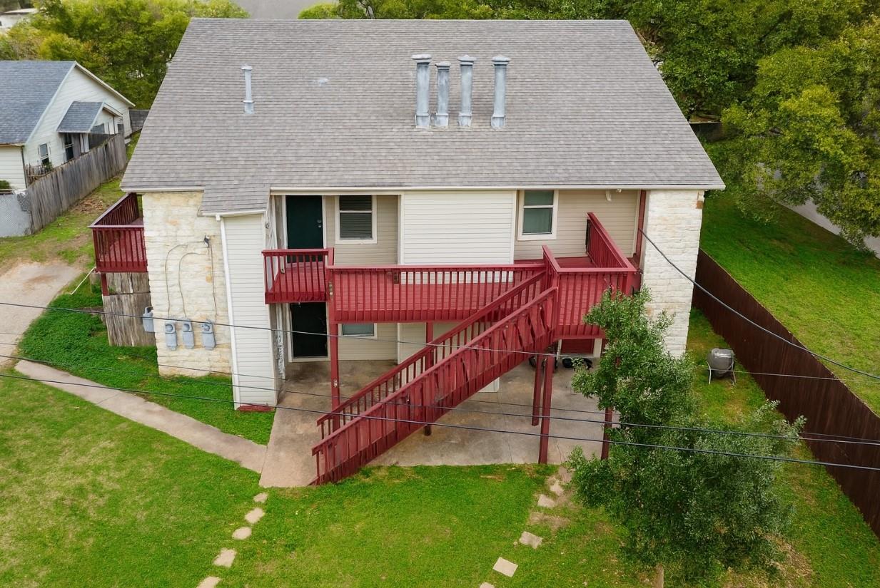 Multi-level wooden decks and exterior stairs conn