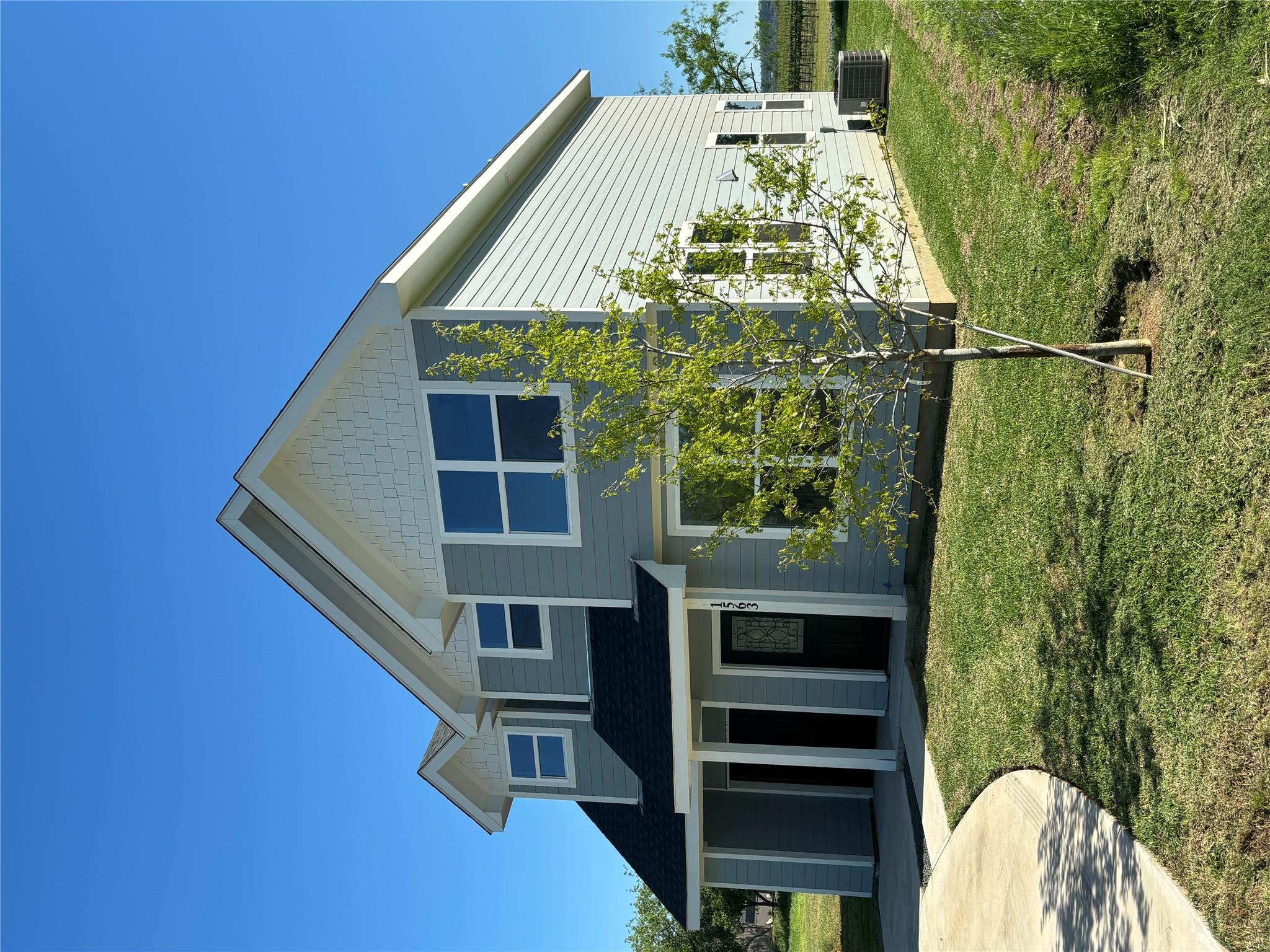 A newly constructed two-story home features class