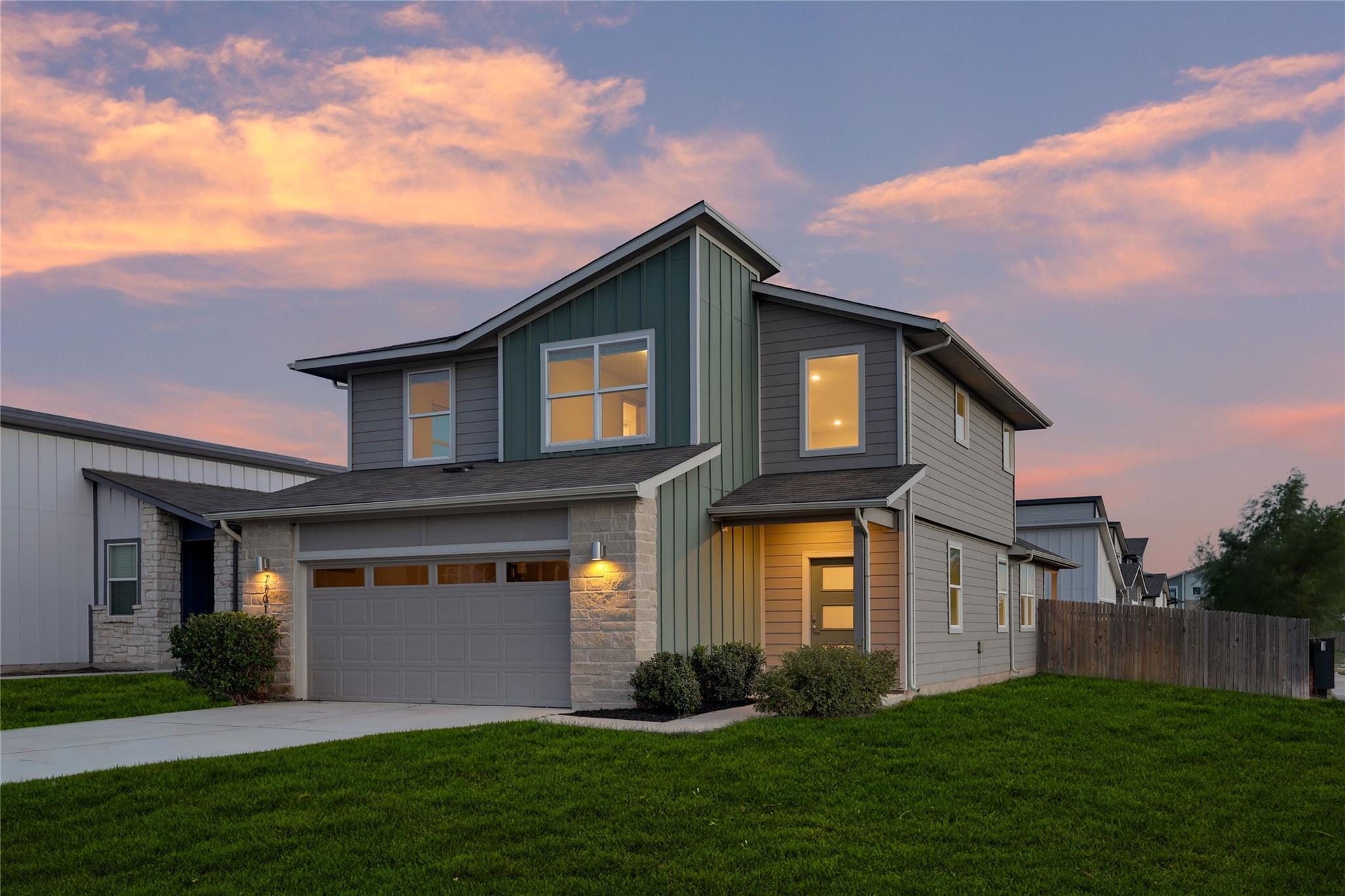A modern two-story exterior showcases mixed sidin