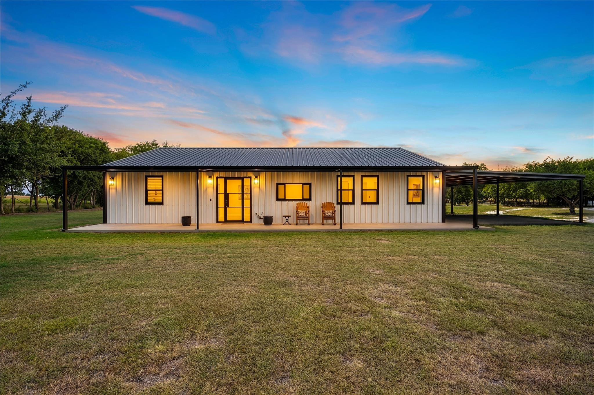 Sleek vertical siding and a durable metal roof de