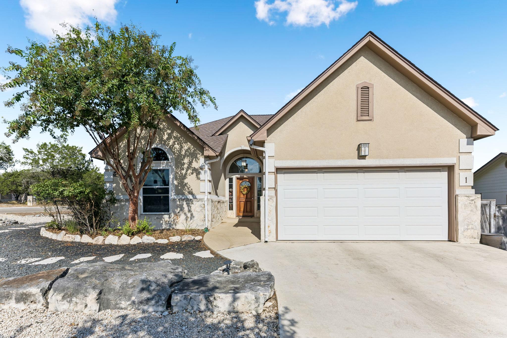 Stucco and stone details define the classic facad