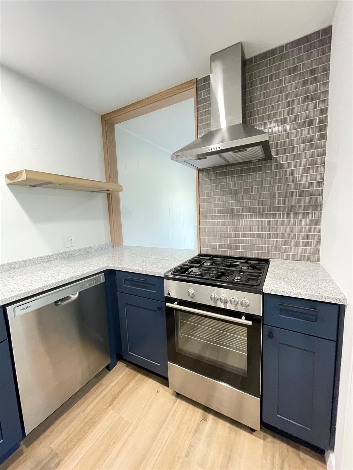 Modern cabinetry and stone countertops complement