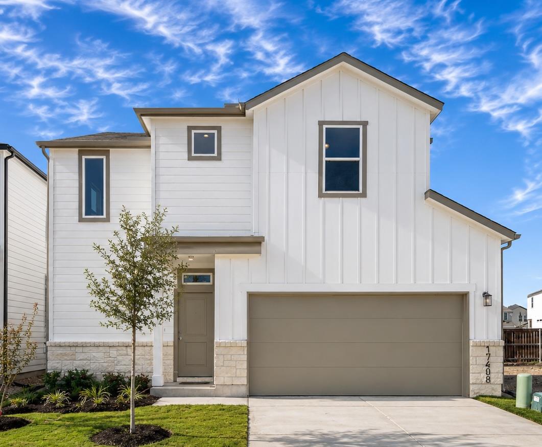 A modern facade with crisp lines, varied siding, 