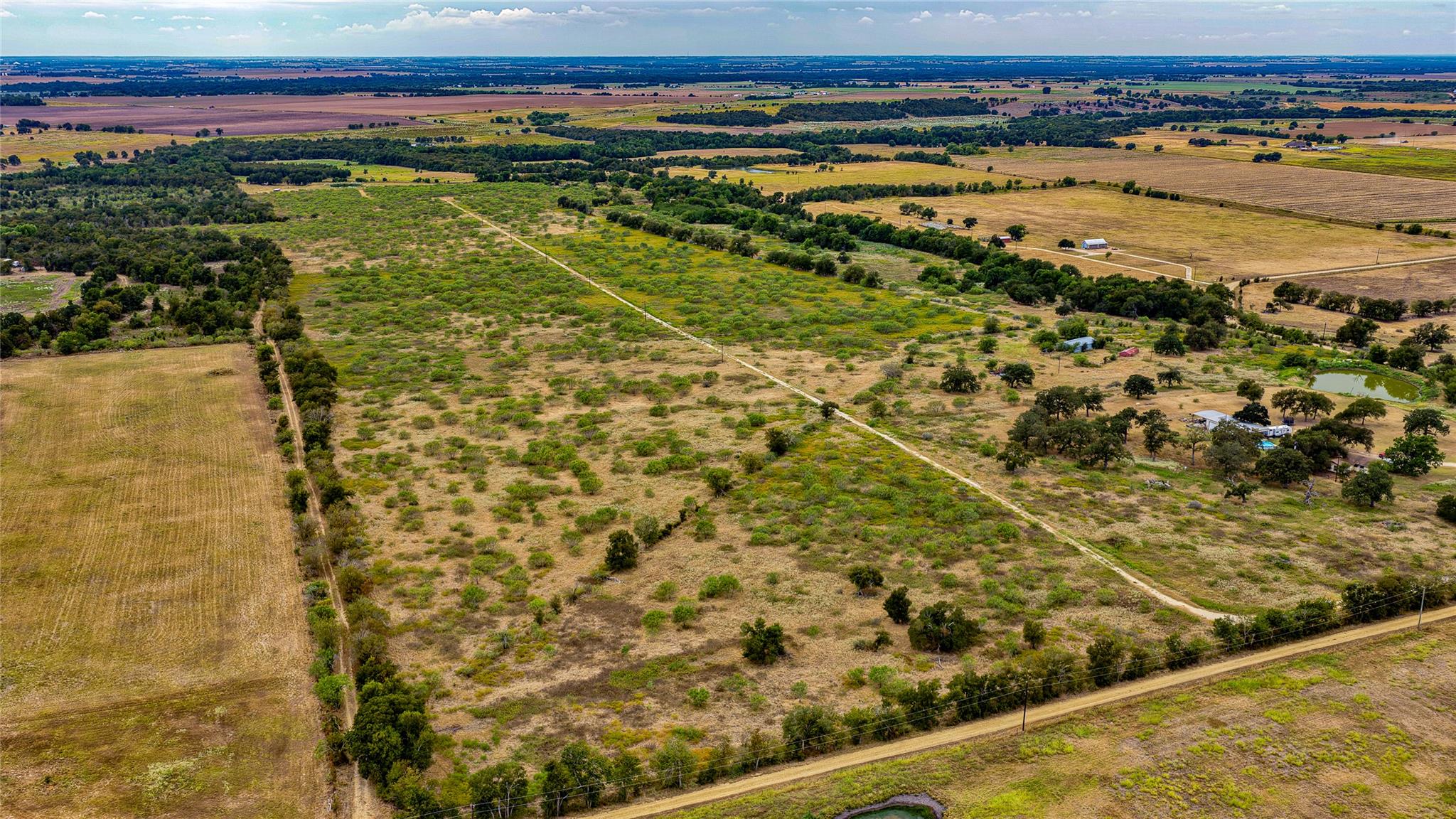Vast acreage features rolling pastureland and mat