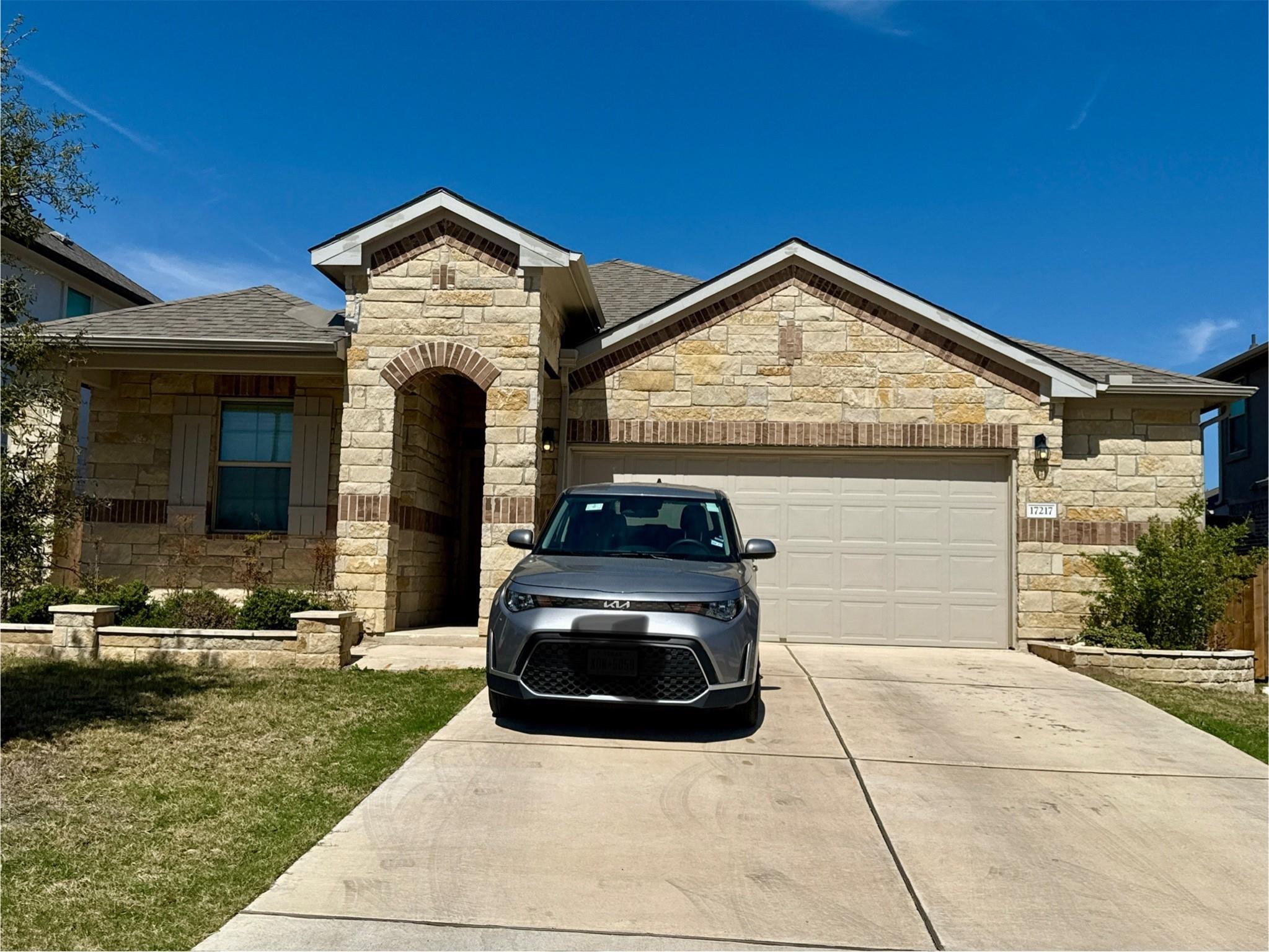 Natural stone masonry and a classic gabled roofli