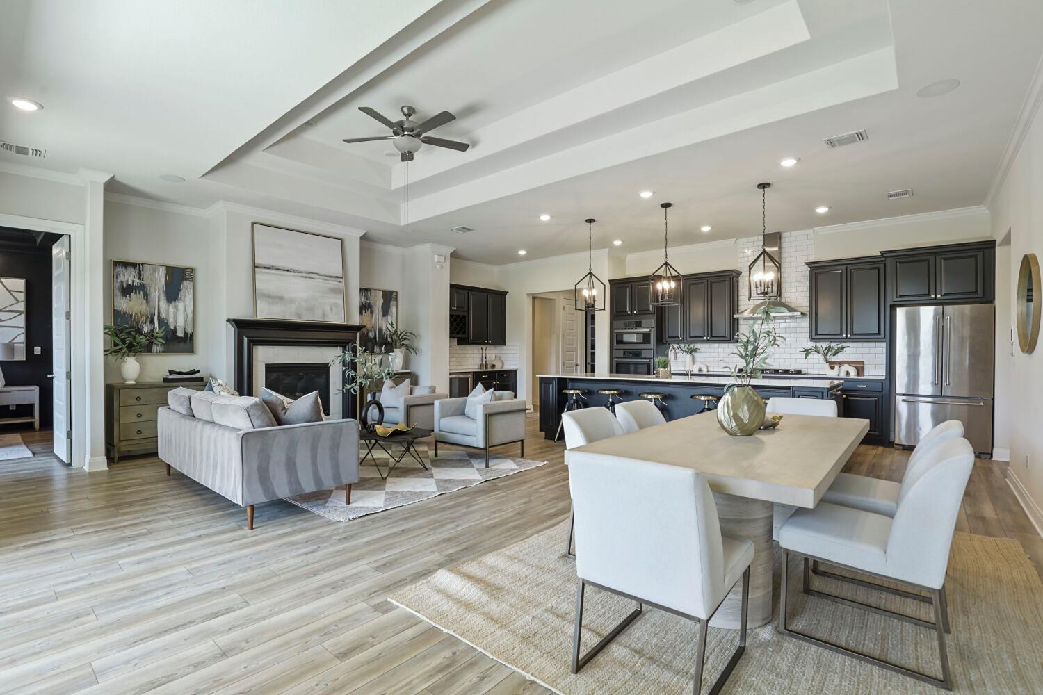 An open-concept living space with a formal firepl