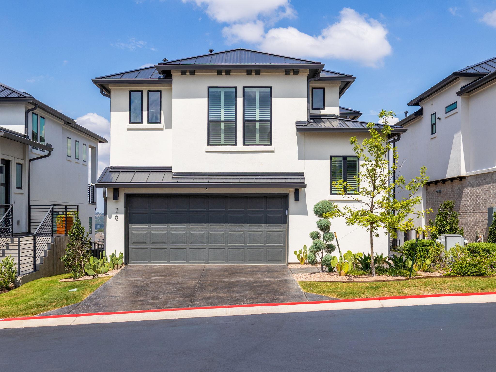 Clean lines and a metal roof define this contempo