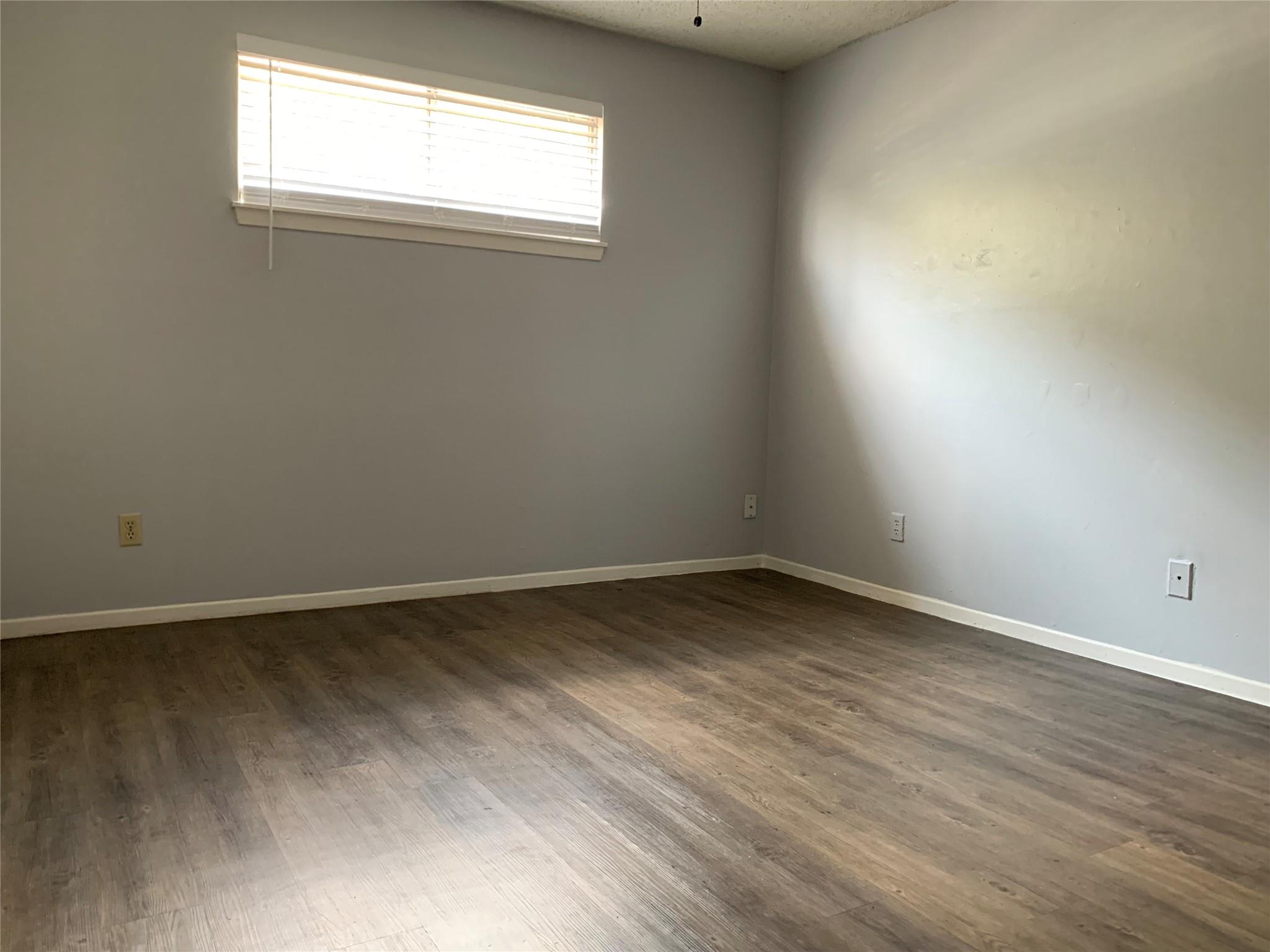 Smooth wood-look flooring complements the clean, 