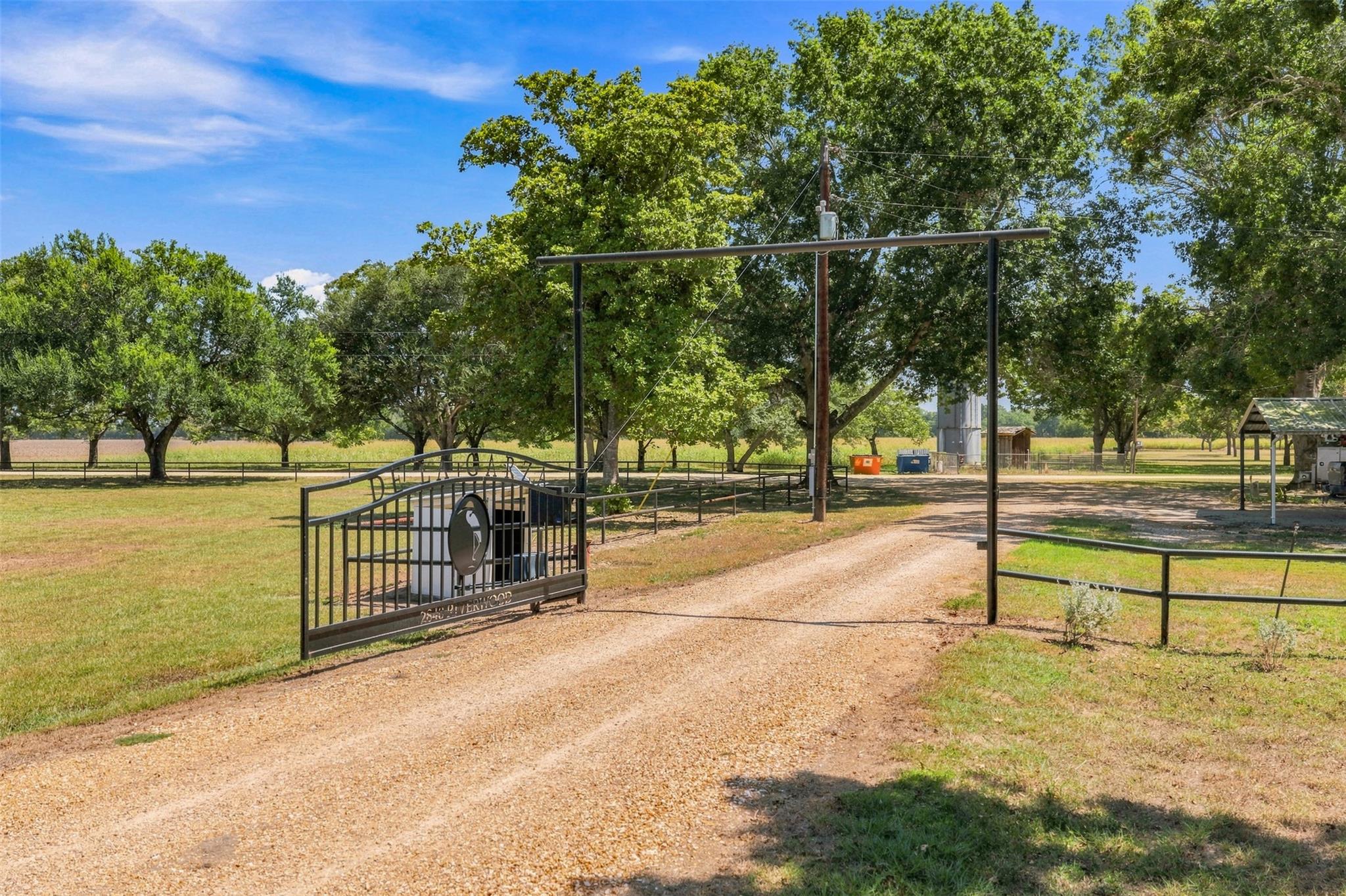 Secure gated entry opens to a private driveway li
