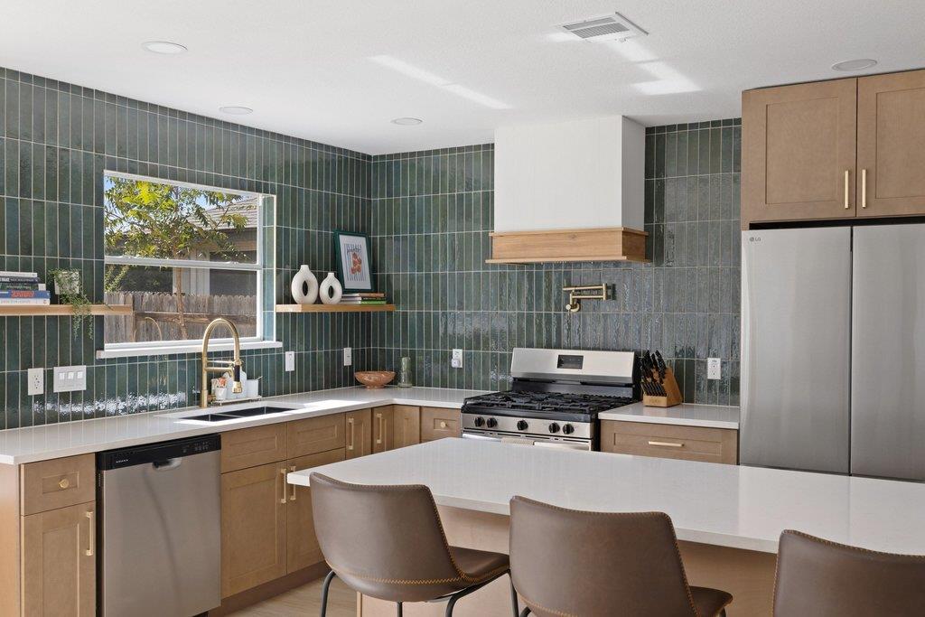 Polished stone counters and vertical tile backspl