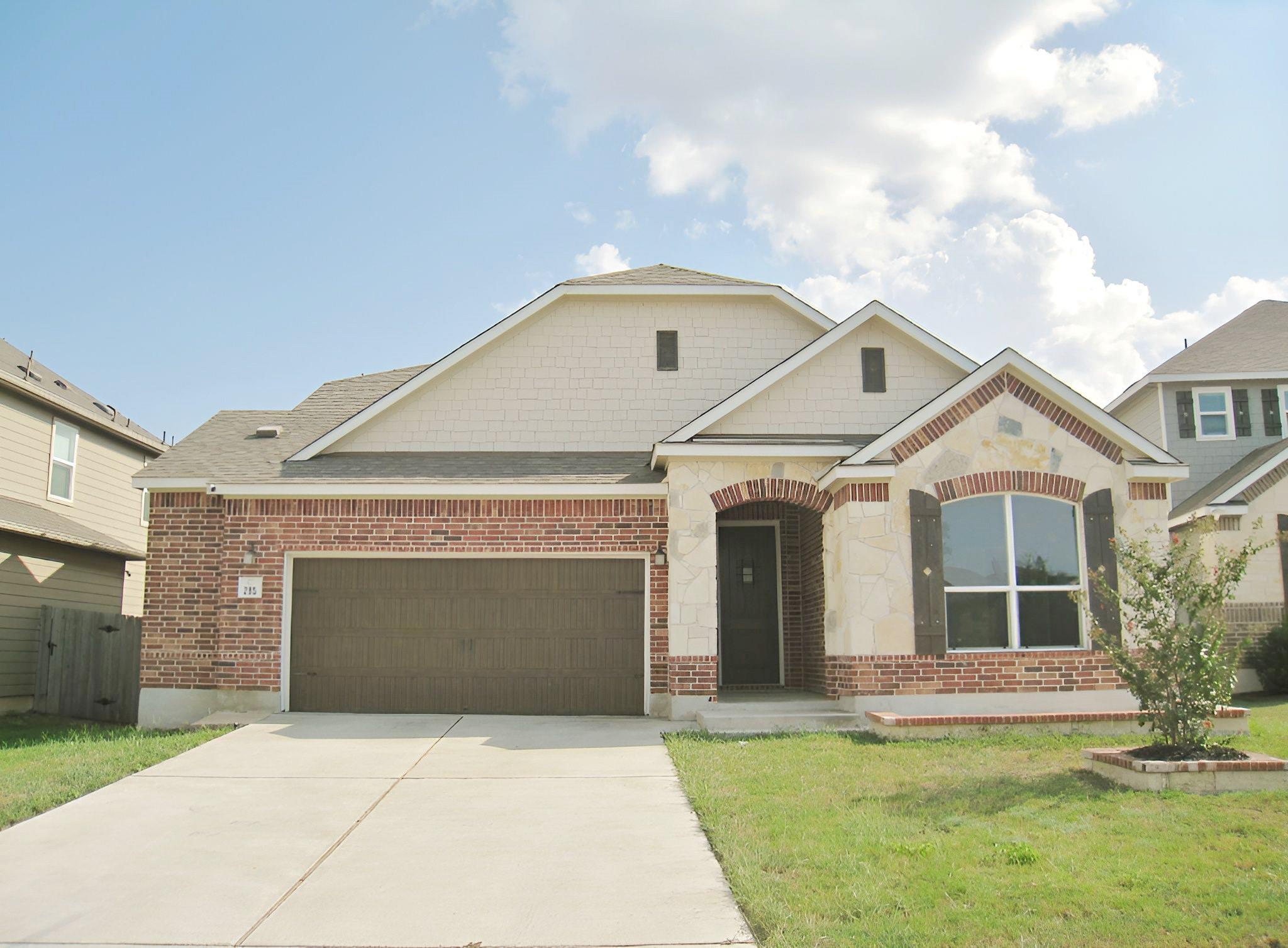 A classic brick and stone facade defines this wel