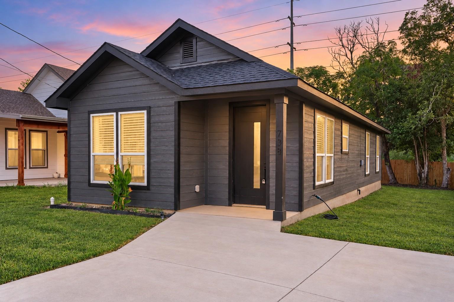 Crisp architectural lines and a manicured lawn de