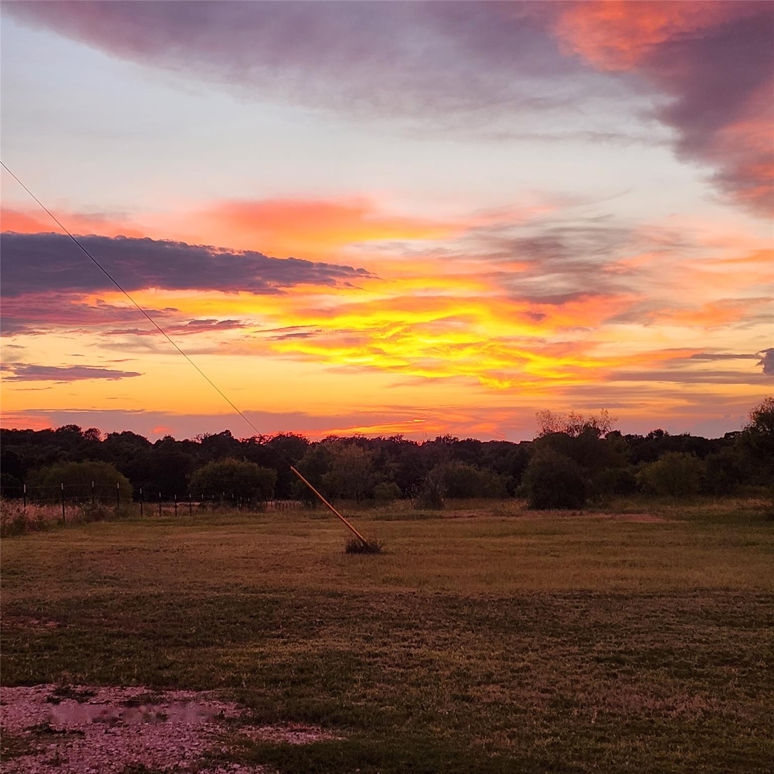 Panoramic sunset views unfold over a vast expanse