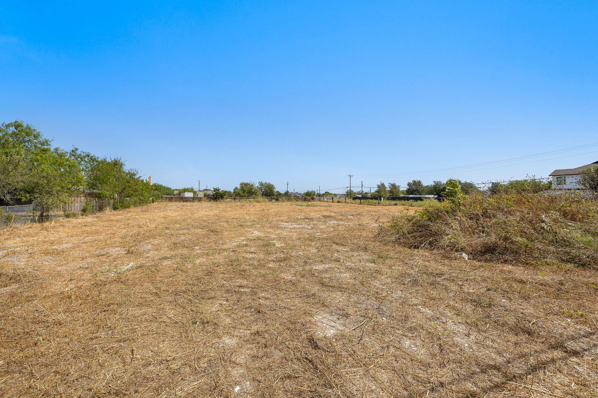 An open and level parcel of land sits ready for f