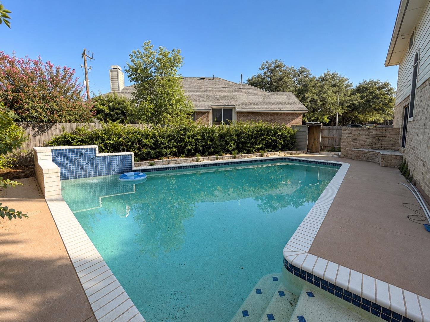 An inviting swimming pool acts as the centerpiece