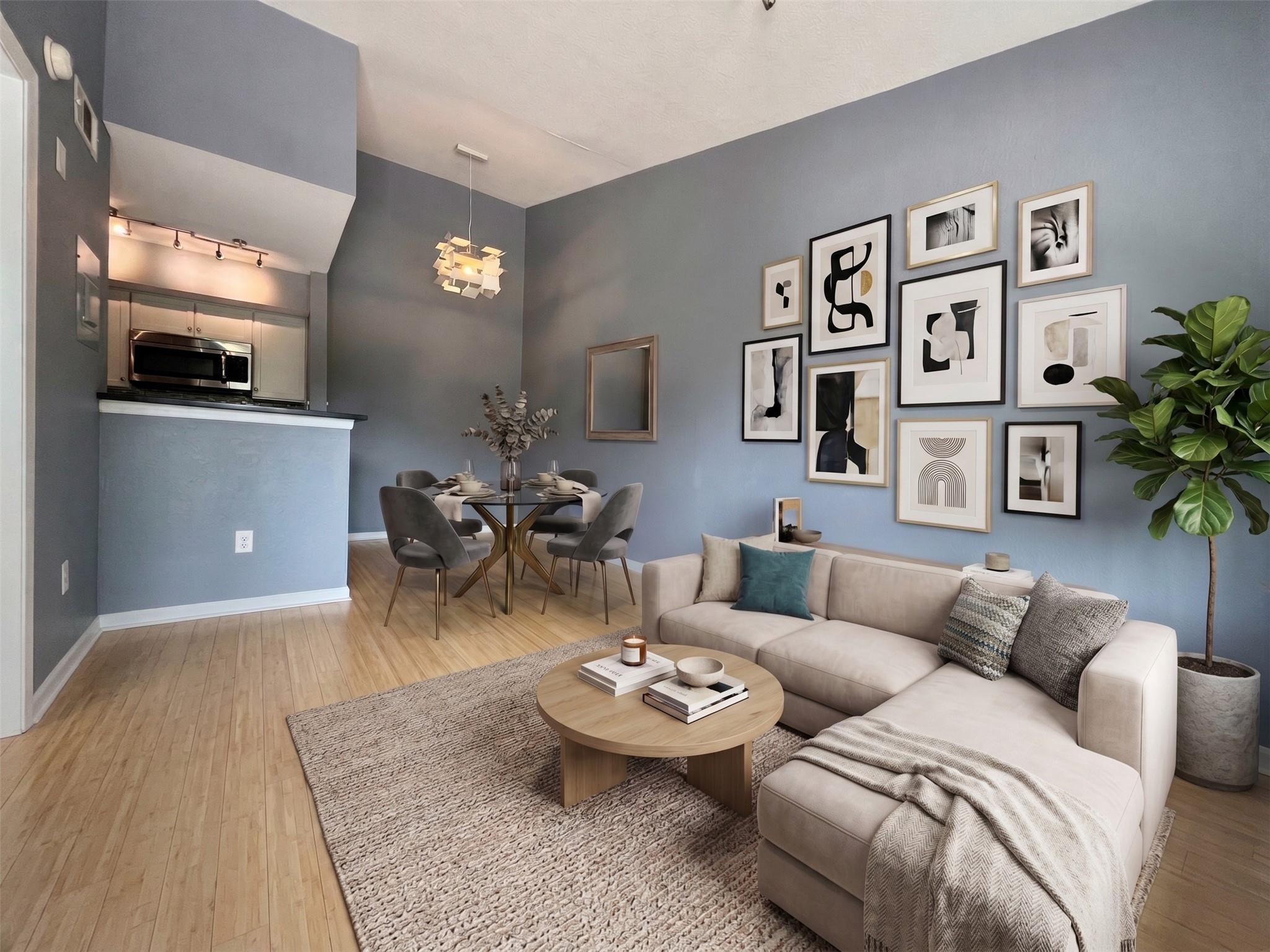 Gleaming hardwood floors and a lofty ceiling defi