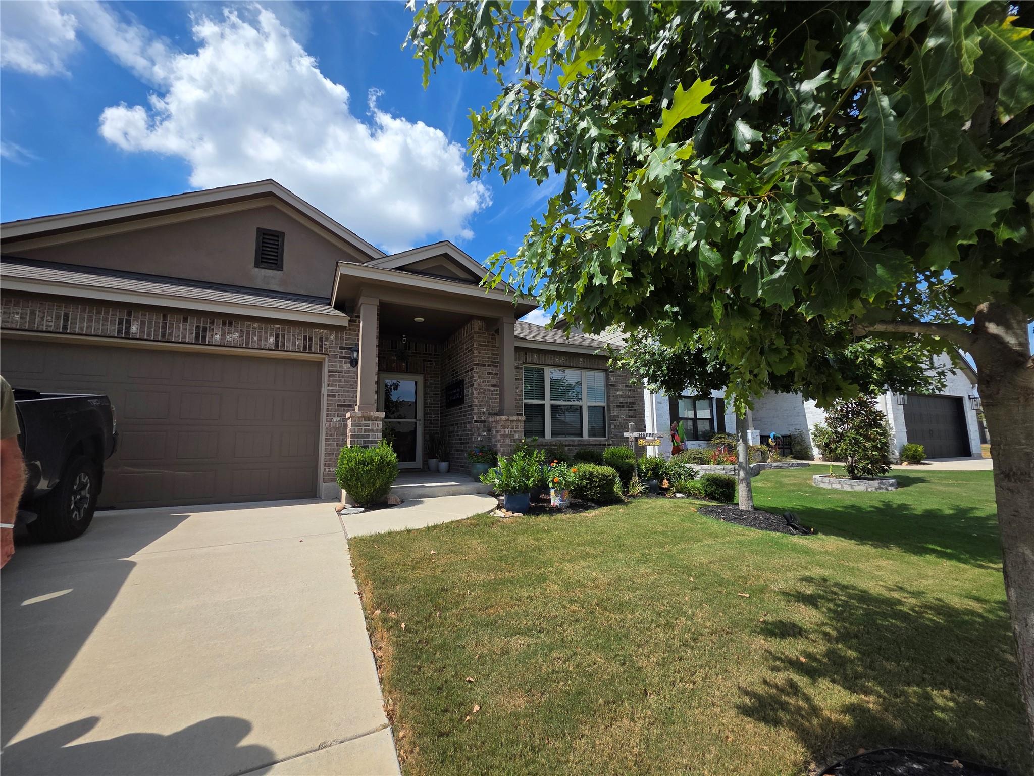 An inviting stone and stucco exterior features a 