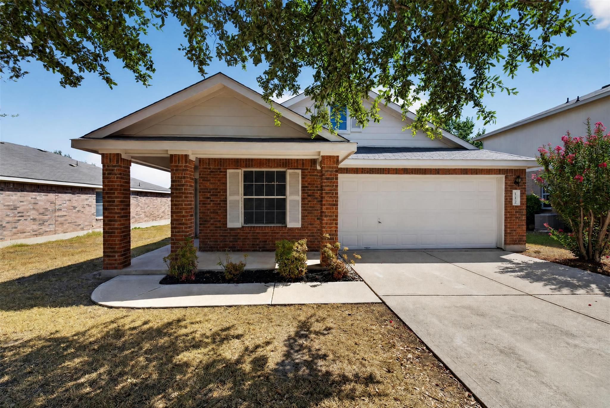 A classic brick exterior and covered front porch 