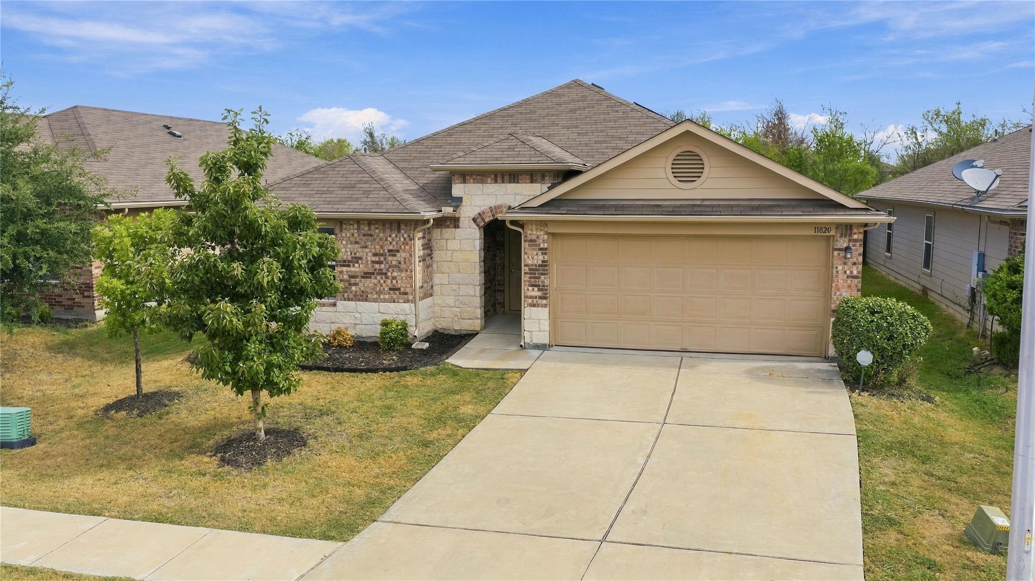 A classic stone and brick exterior defines this i