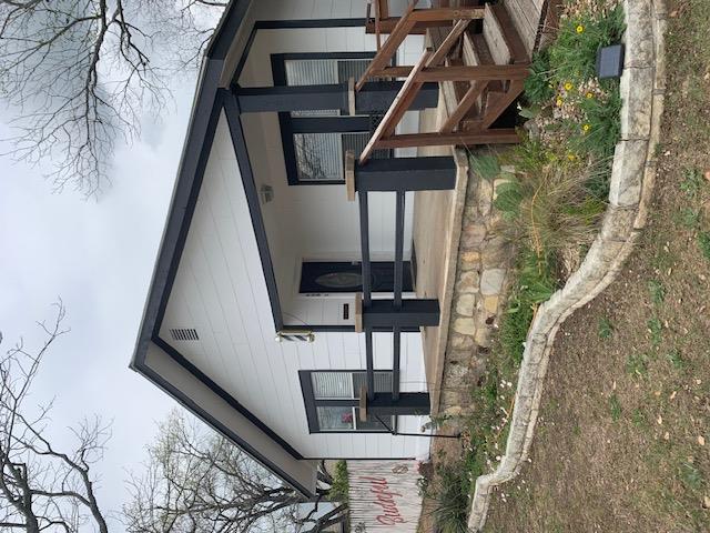 An inviting front porch with stone foundation det