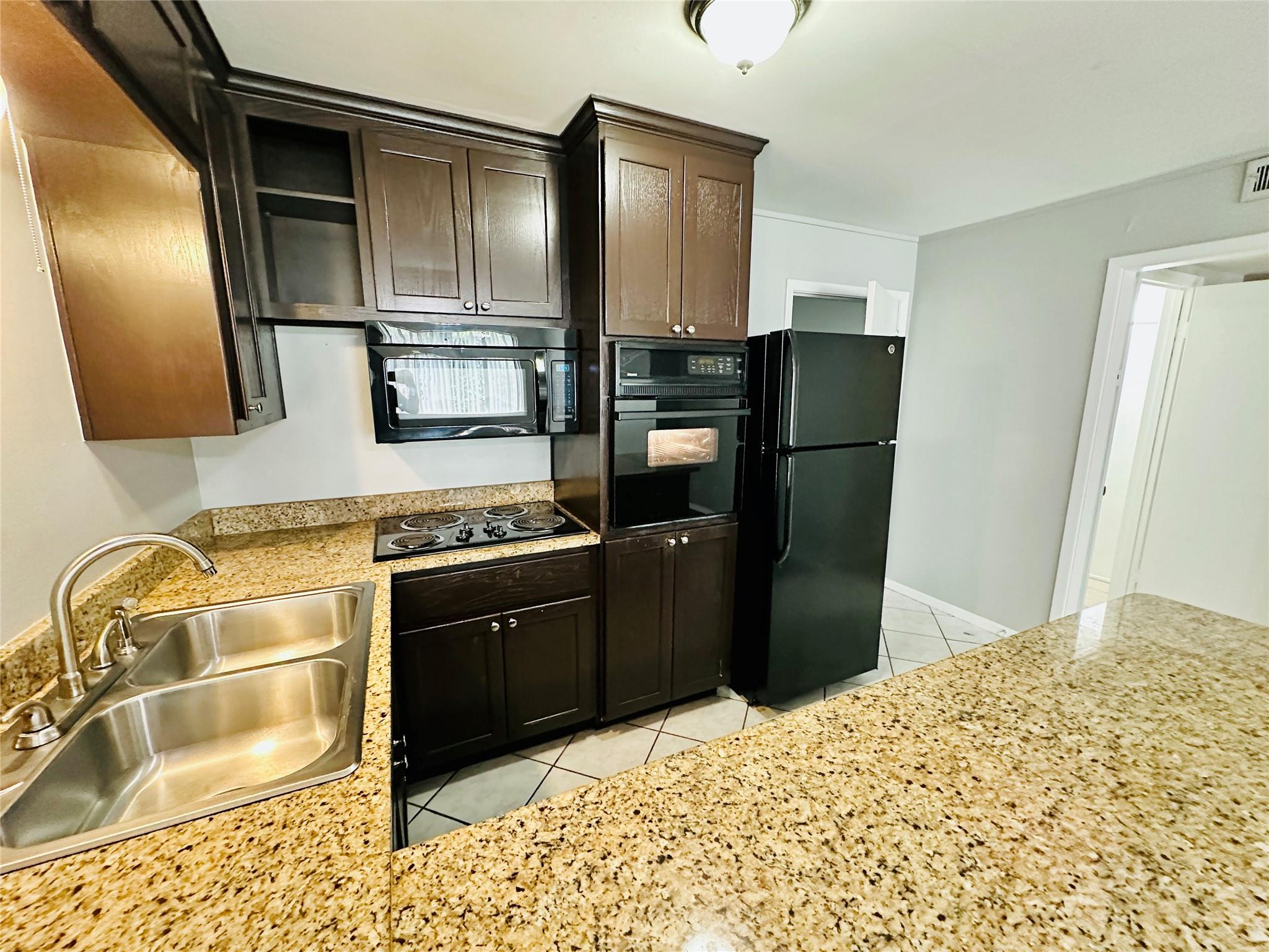 Rich dark wood cabinetry contrasts beautifully wi