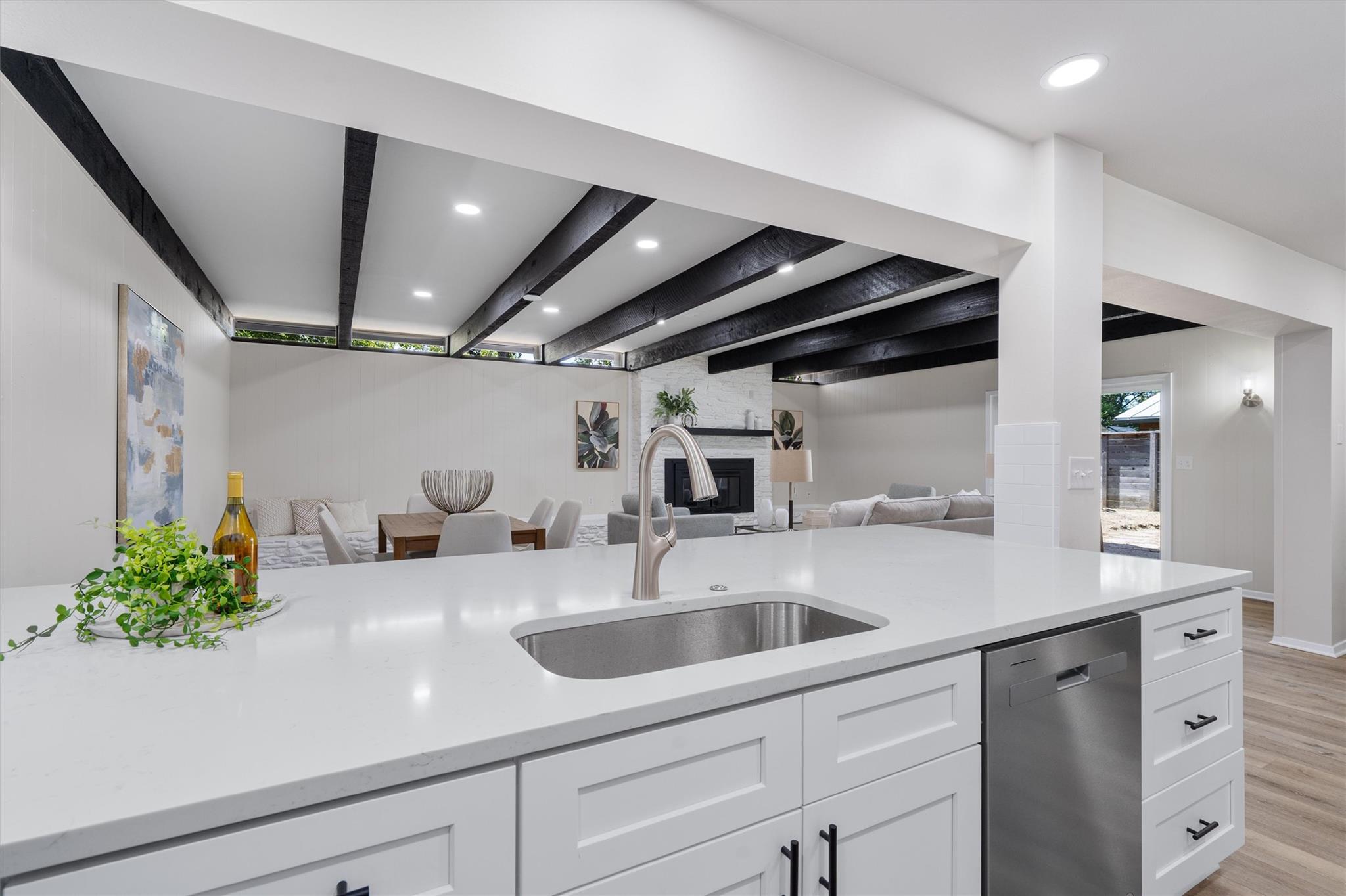 An open kitchen overlooks the main living spaces 