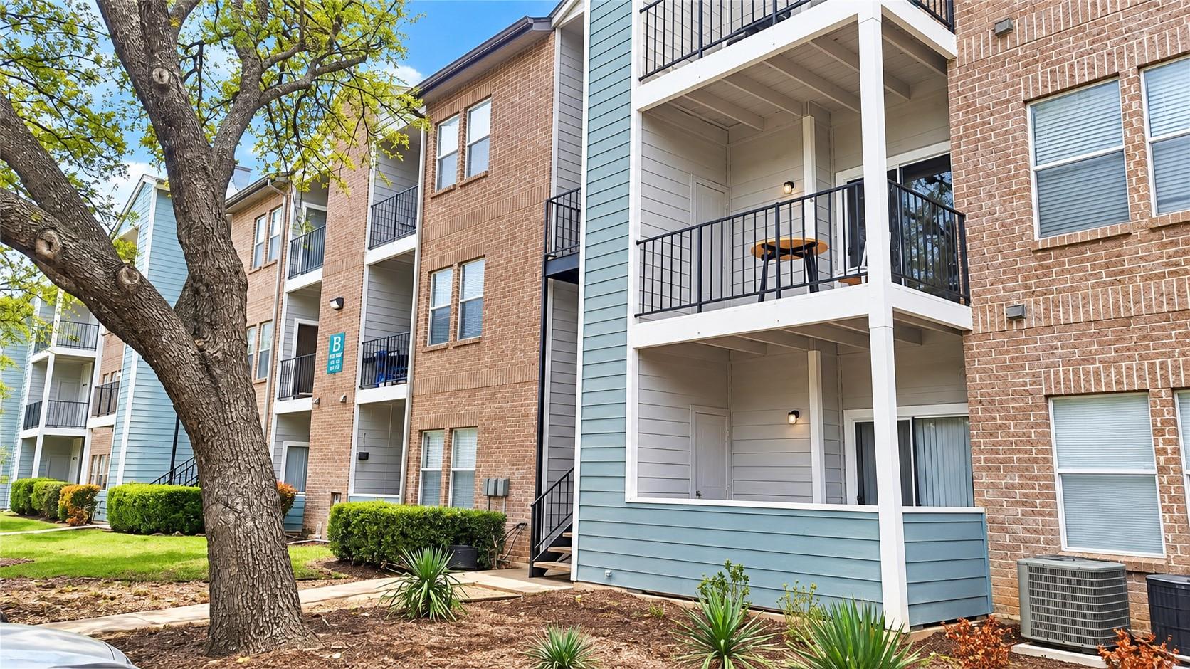 Multi-level brick and siding exterior showcases p