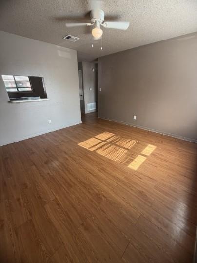 Rich wood-look flooring anchors this versatile sp