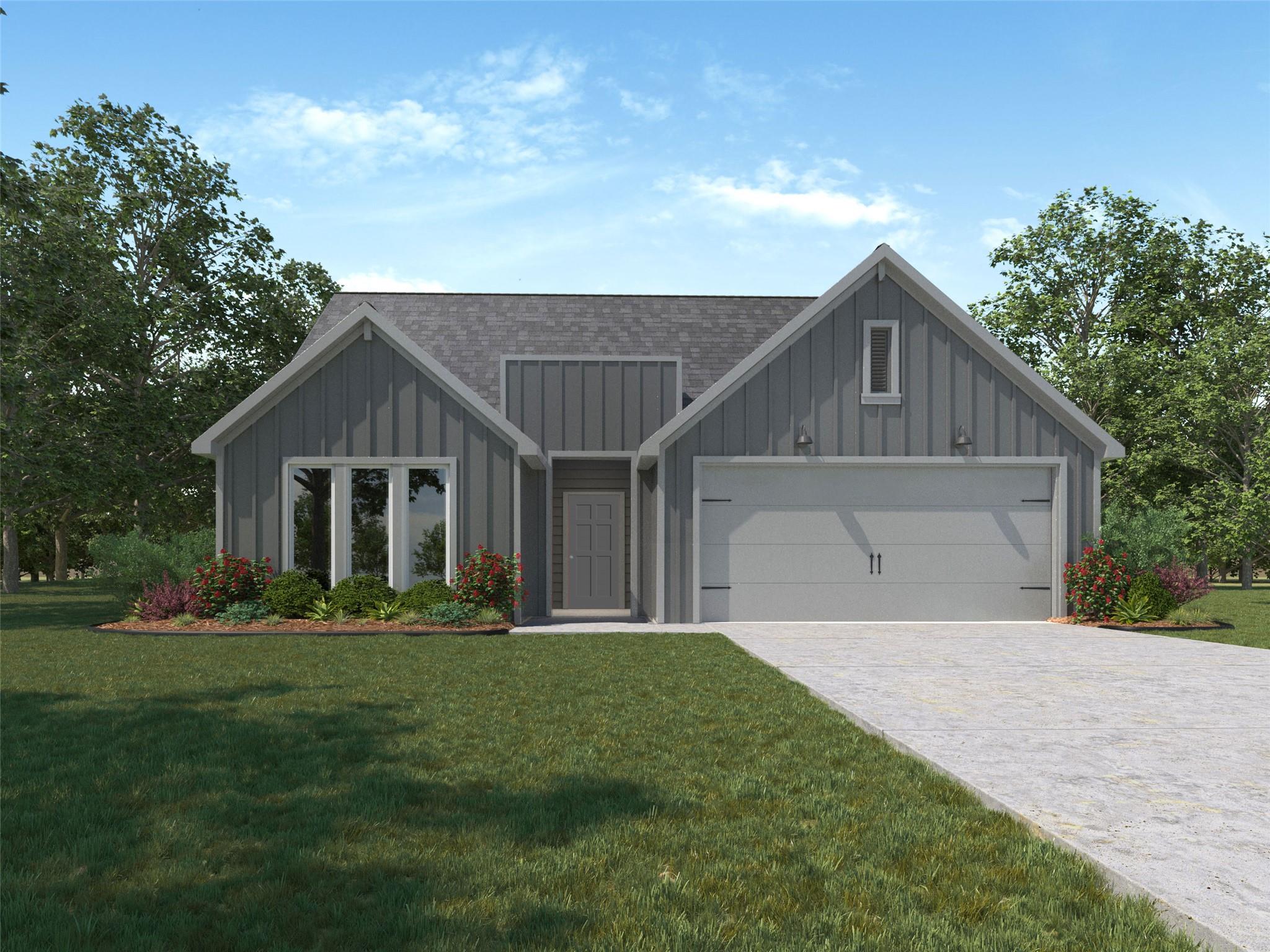 A classic concrete driveway leads to this modern 