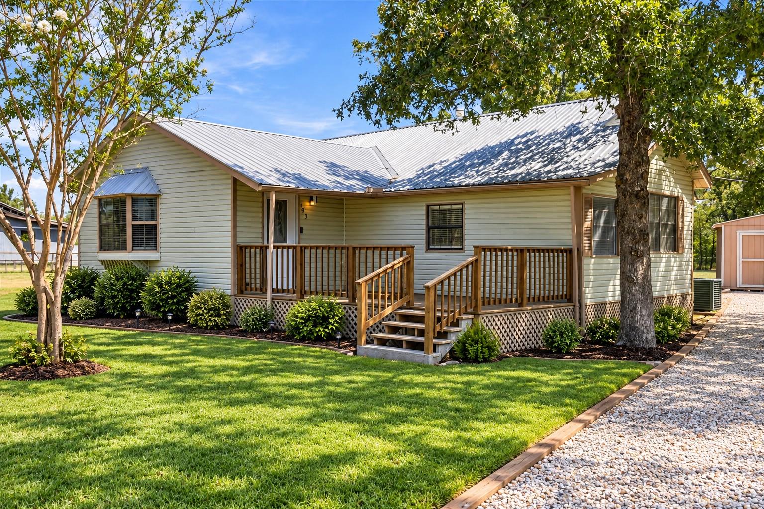 Shaded by mature trees, this charming home featur