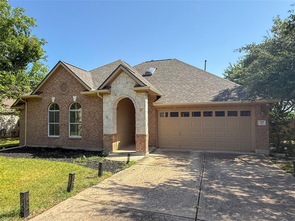 A classic brick exterior presents an arched stone