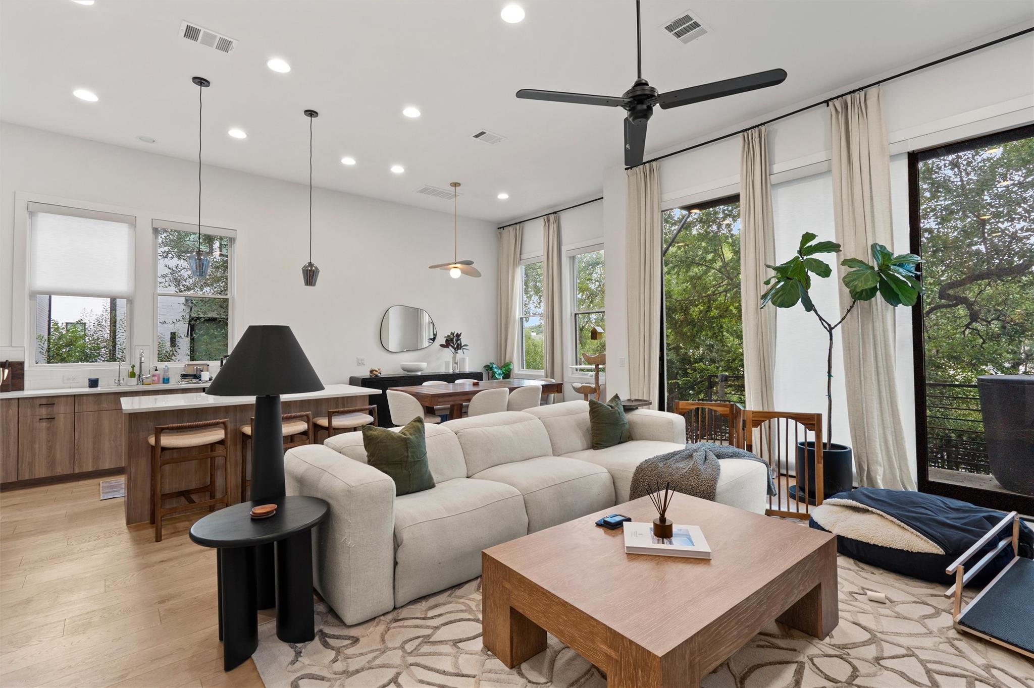 Hardwood floors and massive floor-to-ceiling wind